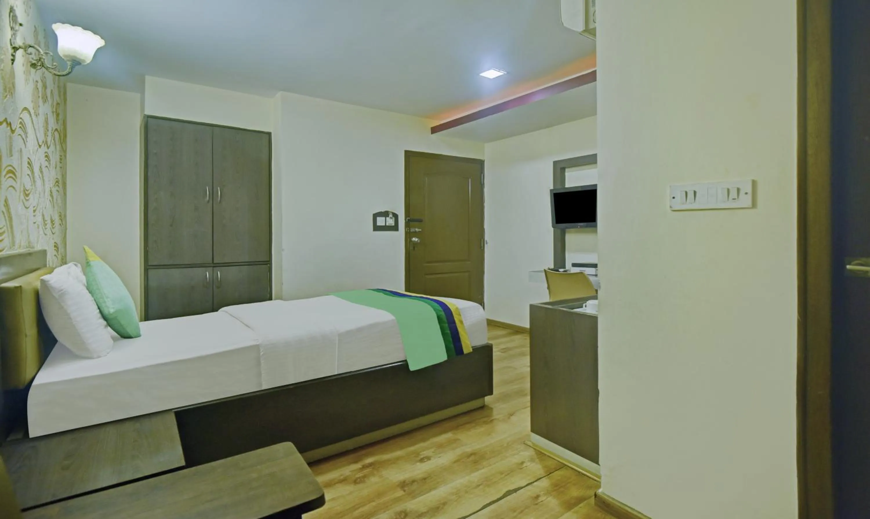 Bedroom, Bed in Treebo Savoury Sea Shell Residency