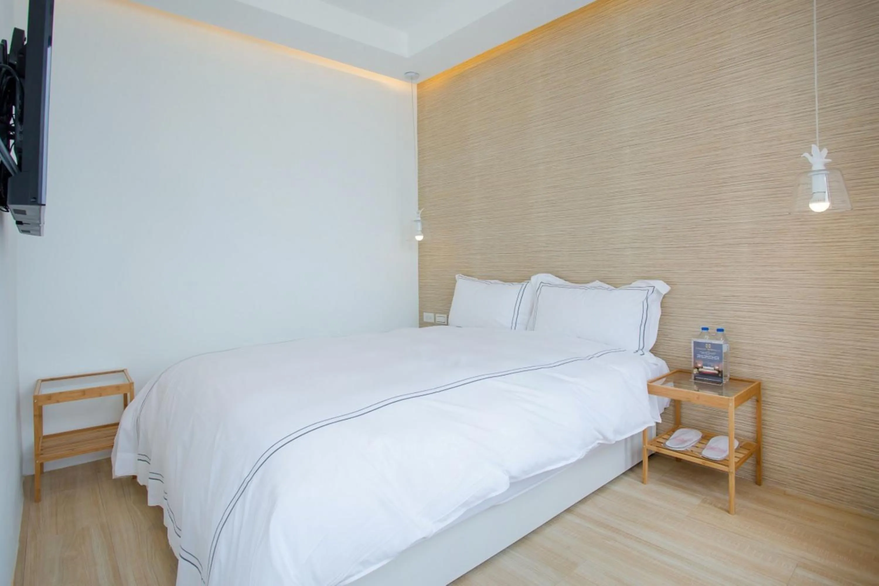 Bed in Mini West Hotel