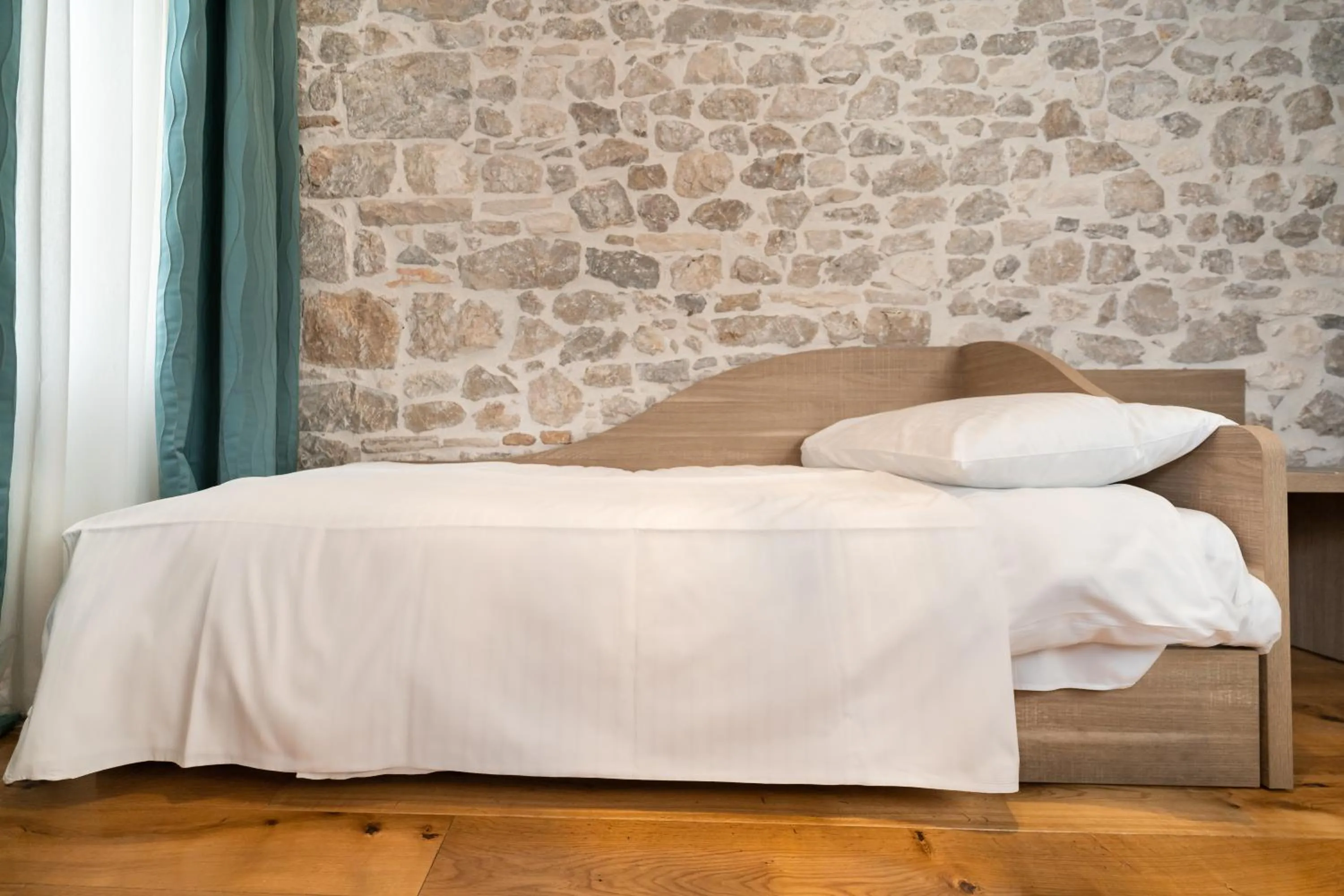 Bed in Tifani Luxury Rooms 2