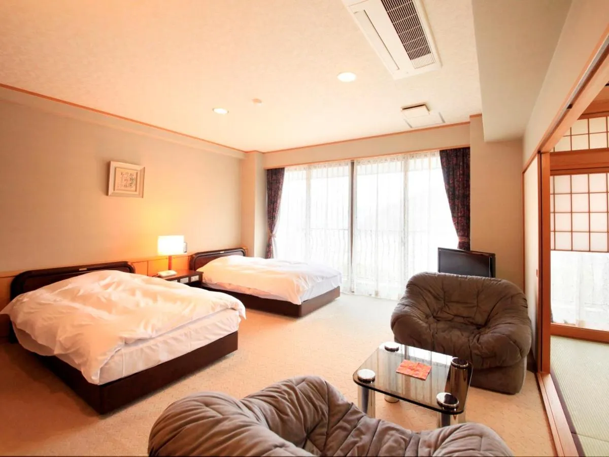 Bed in Hotel Kamogawaso