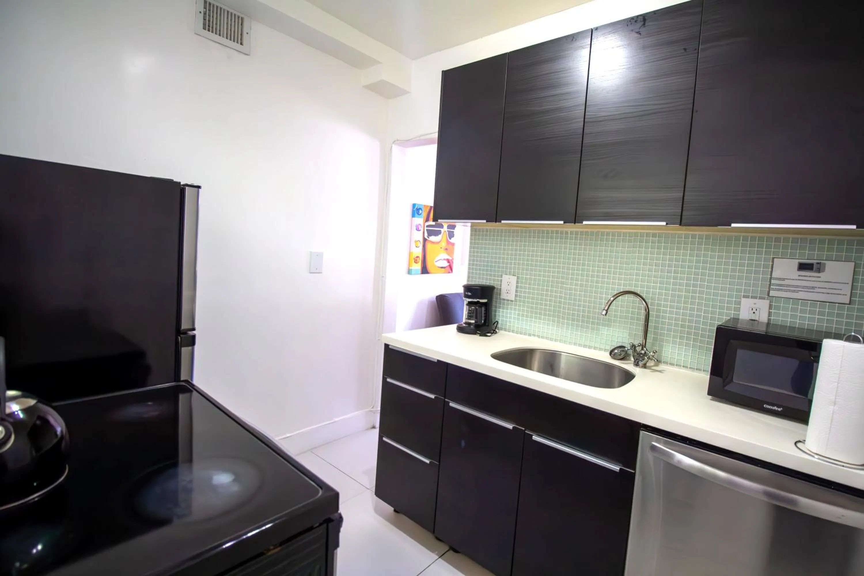Kitchen or kitchenette in Courtyard Apartments Part of the Oasis Casita Collection