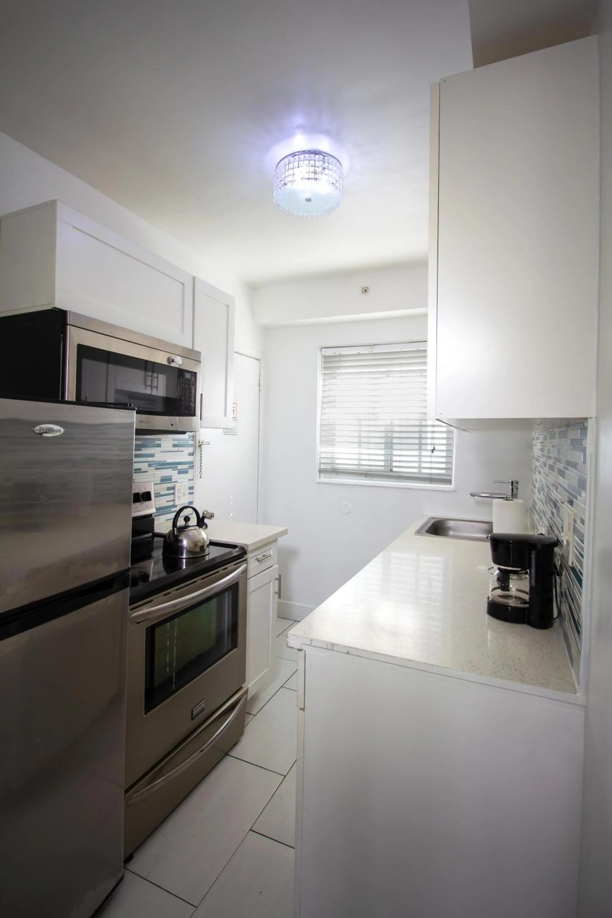 Kitchen or kitchenette in Courtyard Apartments Part of the Oasis Casita Collection
