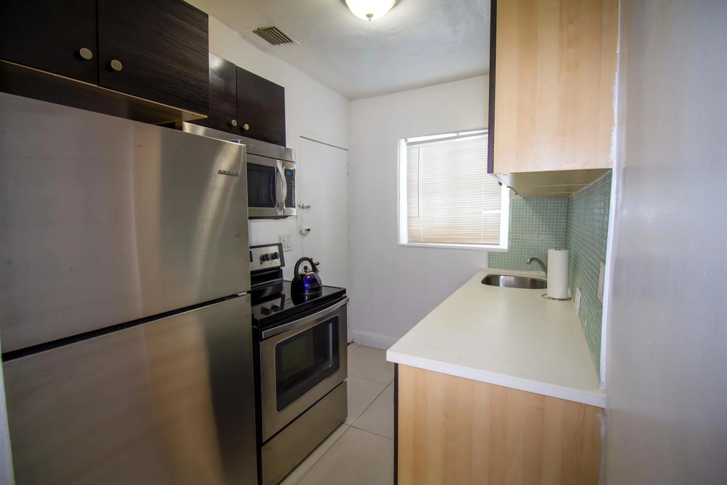 Kitchen or kitchenette in Courtyard Apartments Part of the Oasis Casita Collection
