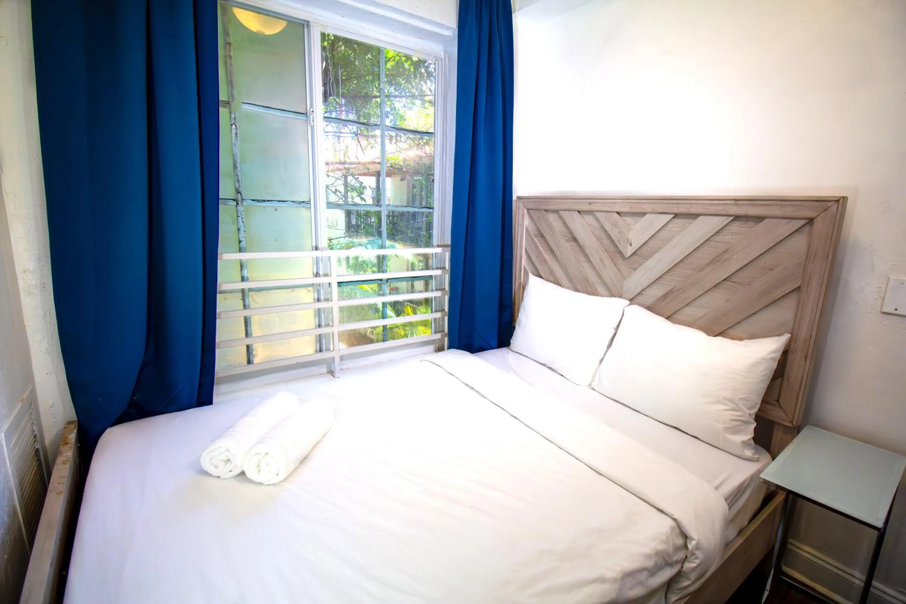 Bed in Courtyard Apartments Part of the Oasis Casita Collection