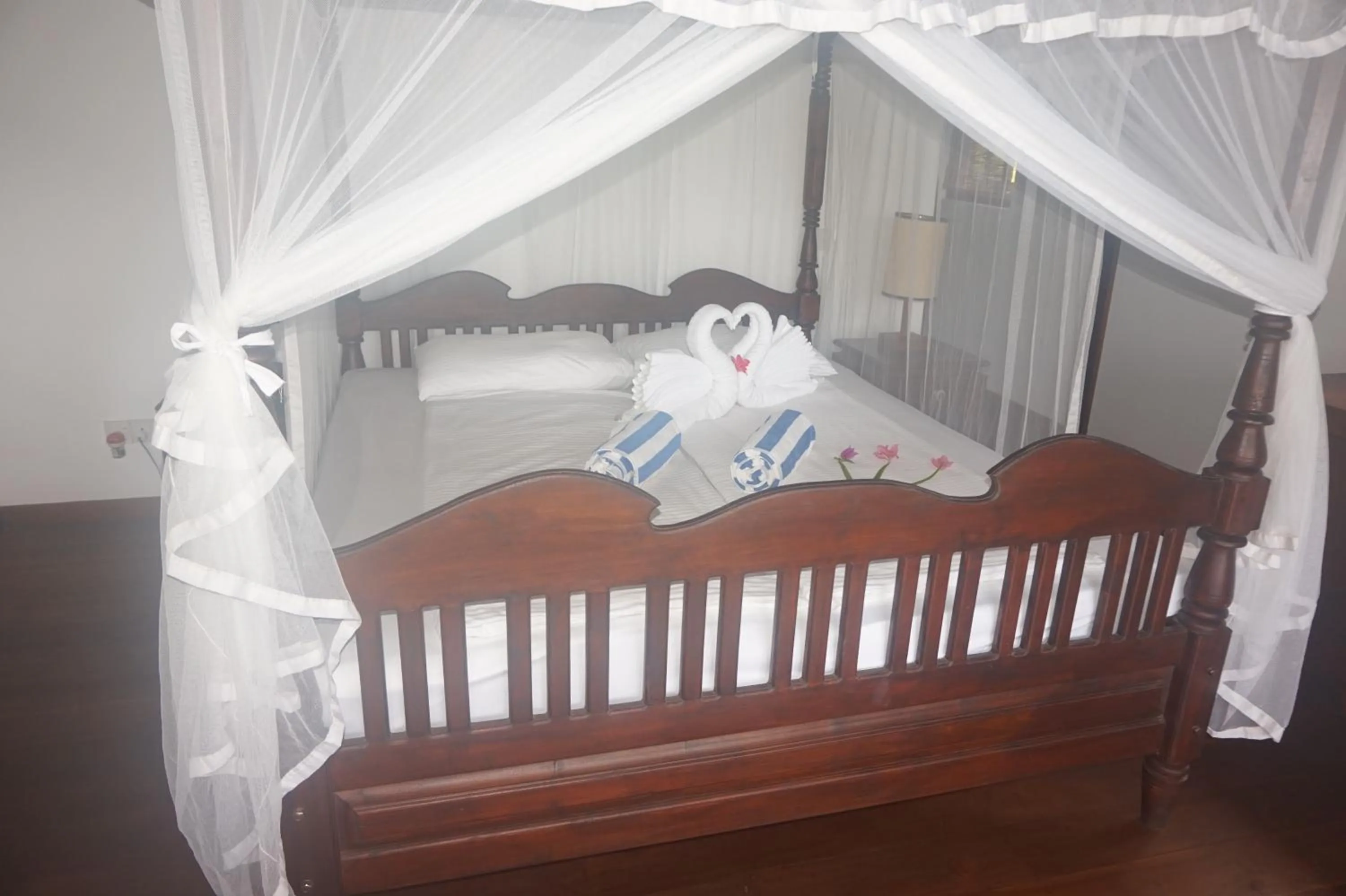 Bed in Lanka Beach Boutique Bungalows & Grand Villa