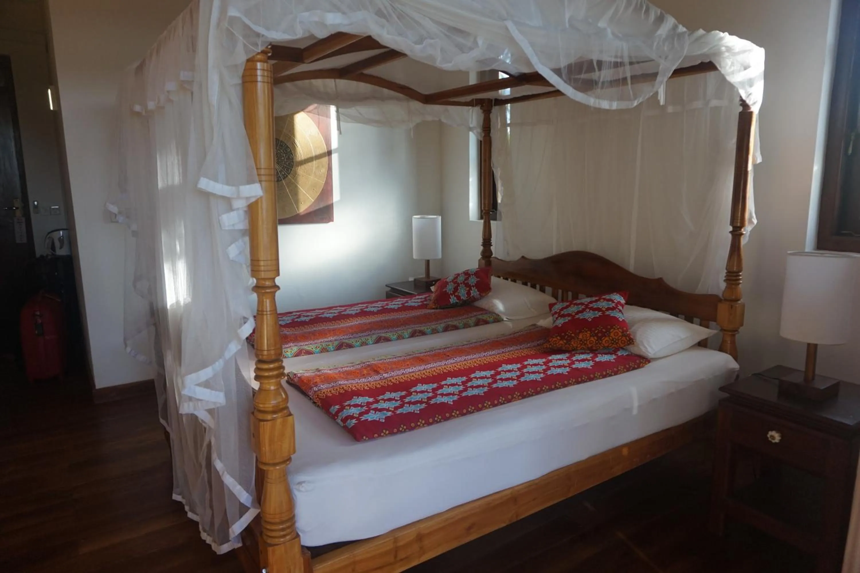Bed in Lanka Beach Boutique Bungalows & Grand Villa
