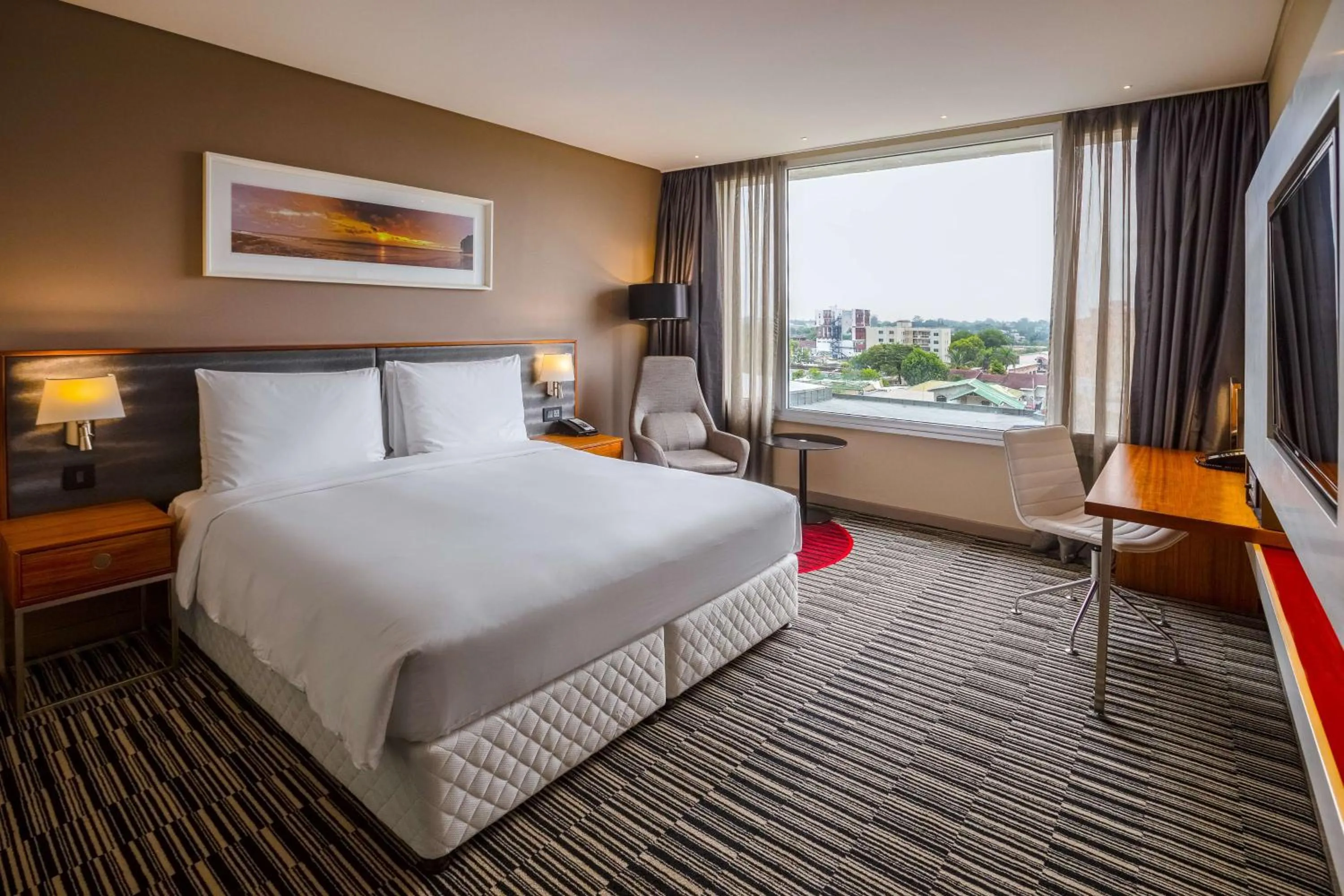 Photo of the whole room, Bed in Radisson Blu Okoume Palace Hotel, Libreville