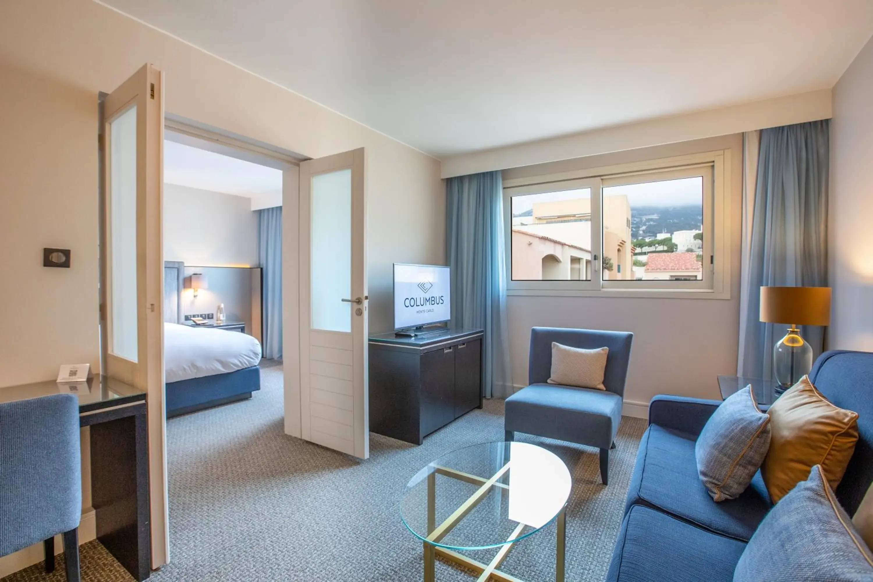 Living room, Bed in Columbus Hotel Monte-Carlo, Curio Collection by Hilton Living room, Bed in Columbus Hotel Monte-Carlo, Curio Collection by Hilton