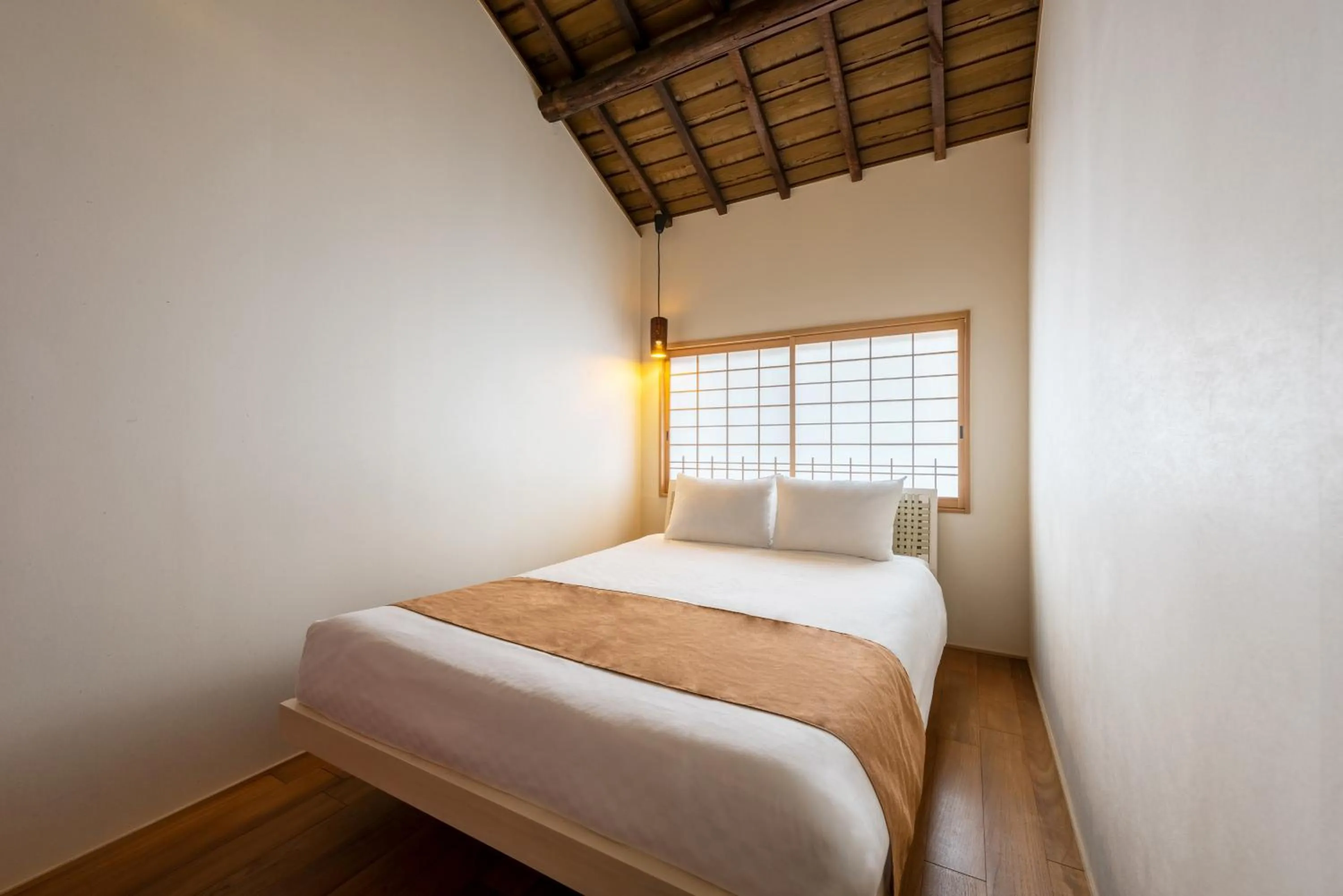 Bed in Choya Chawanzaka Machiya House