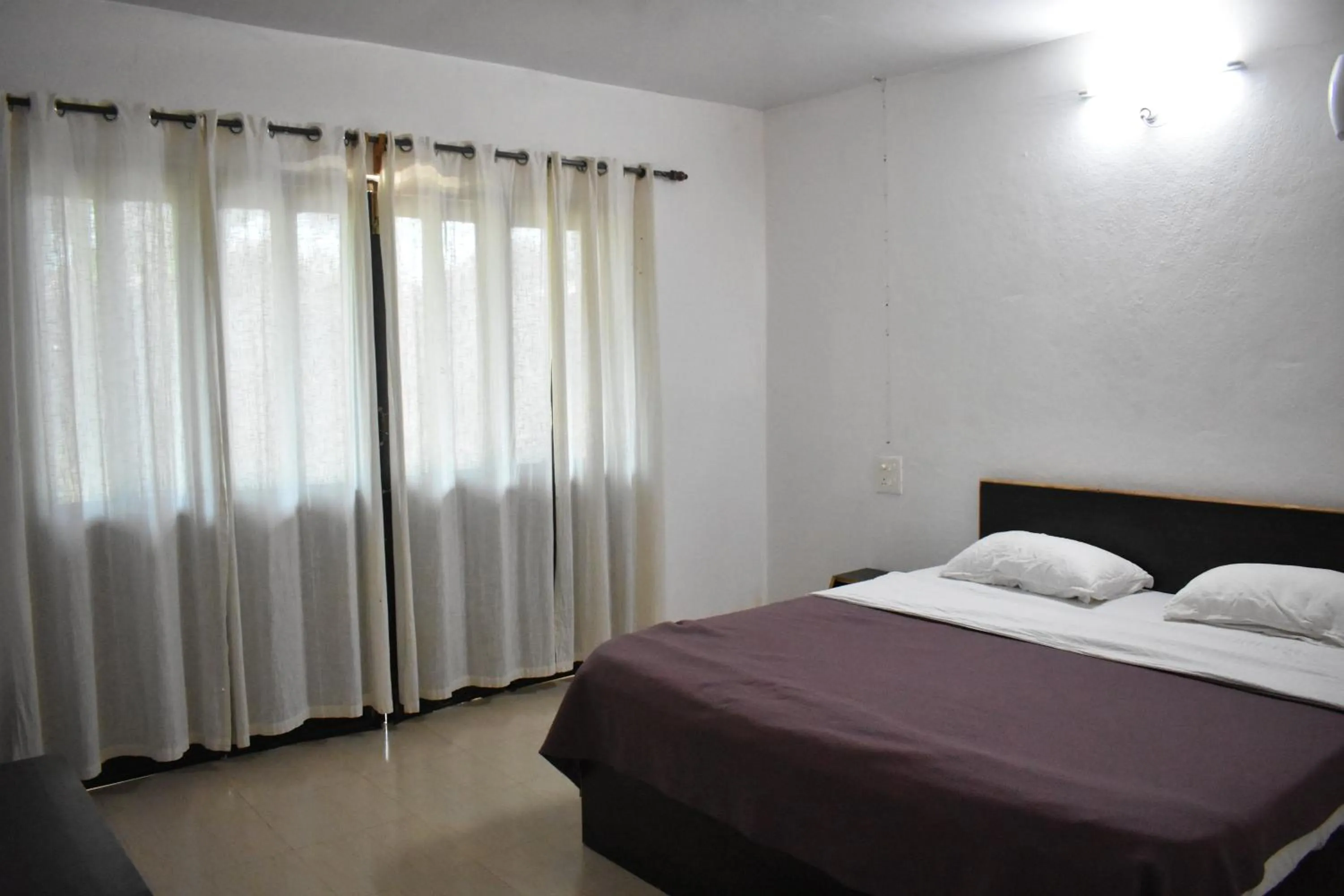 Bed in Club Palolem Resort