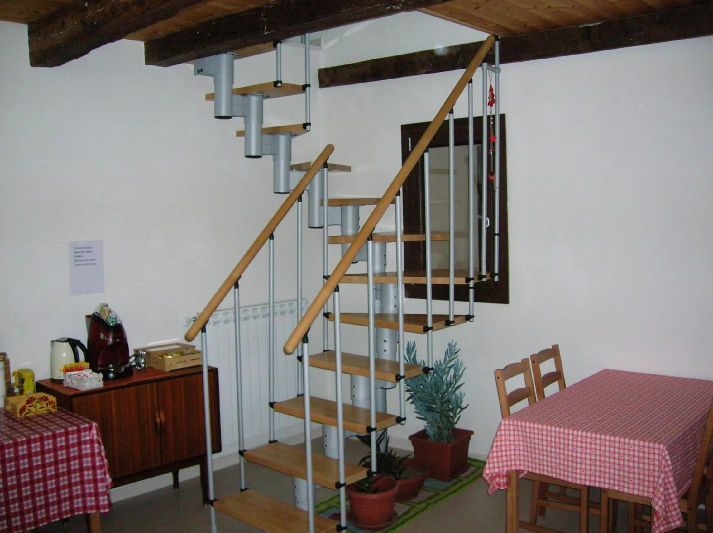 Communal lounge/ TV room in B&B Al Carotin