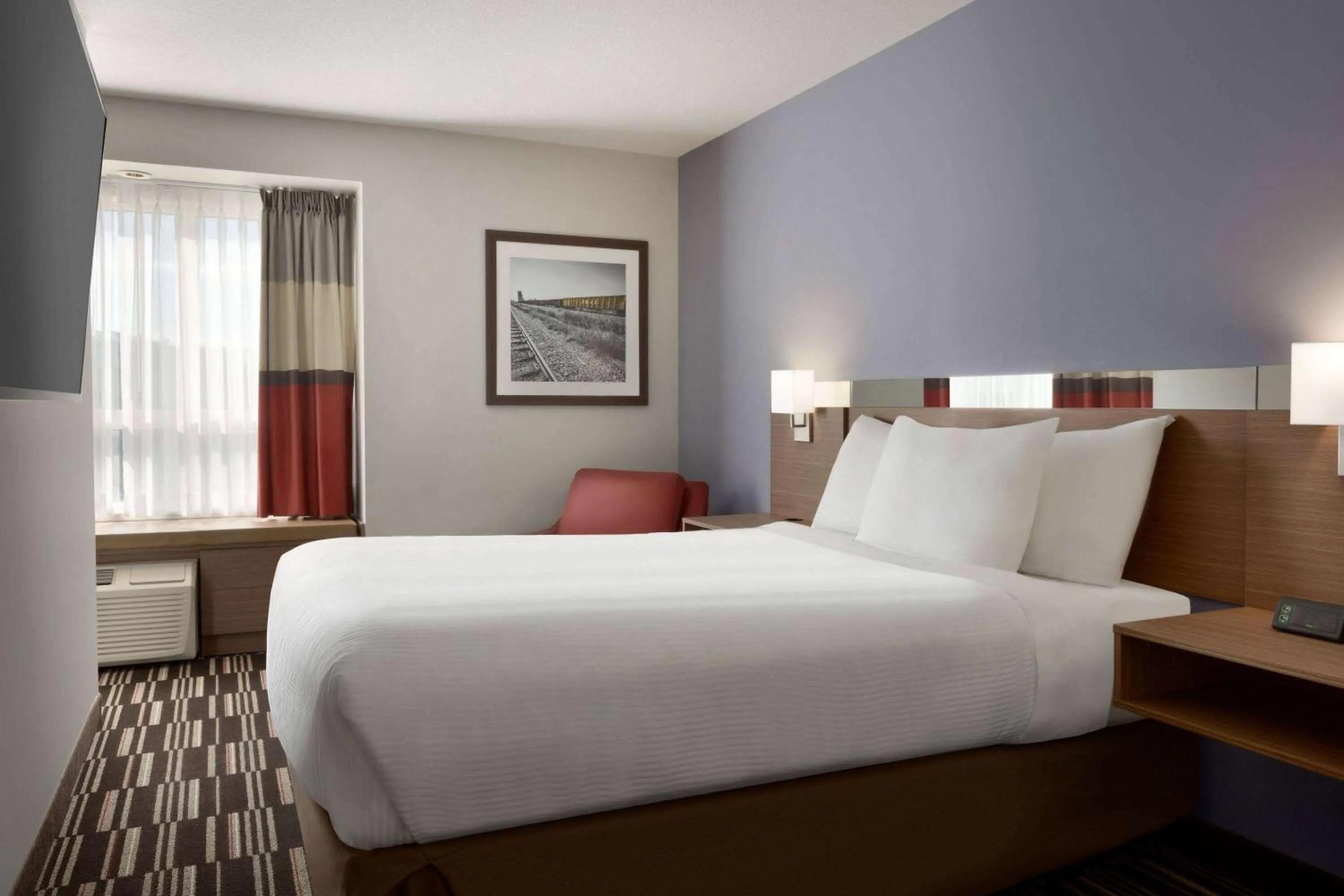 Bed in Microtel Inn & Suites by Wyndham Bonnyville