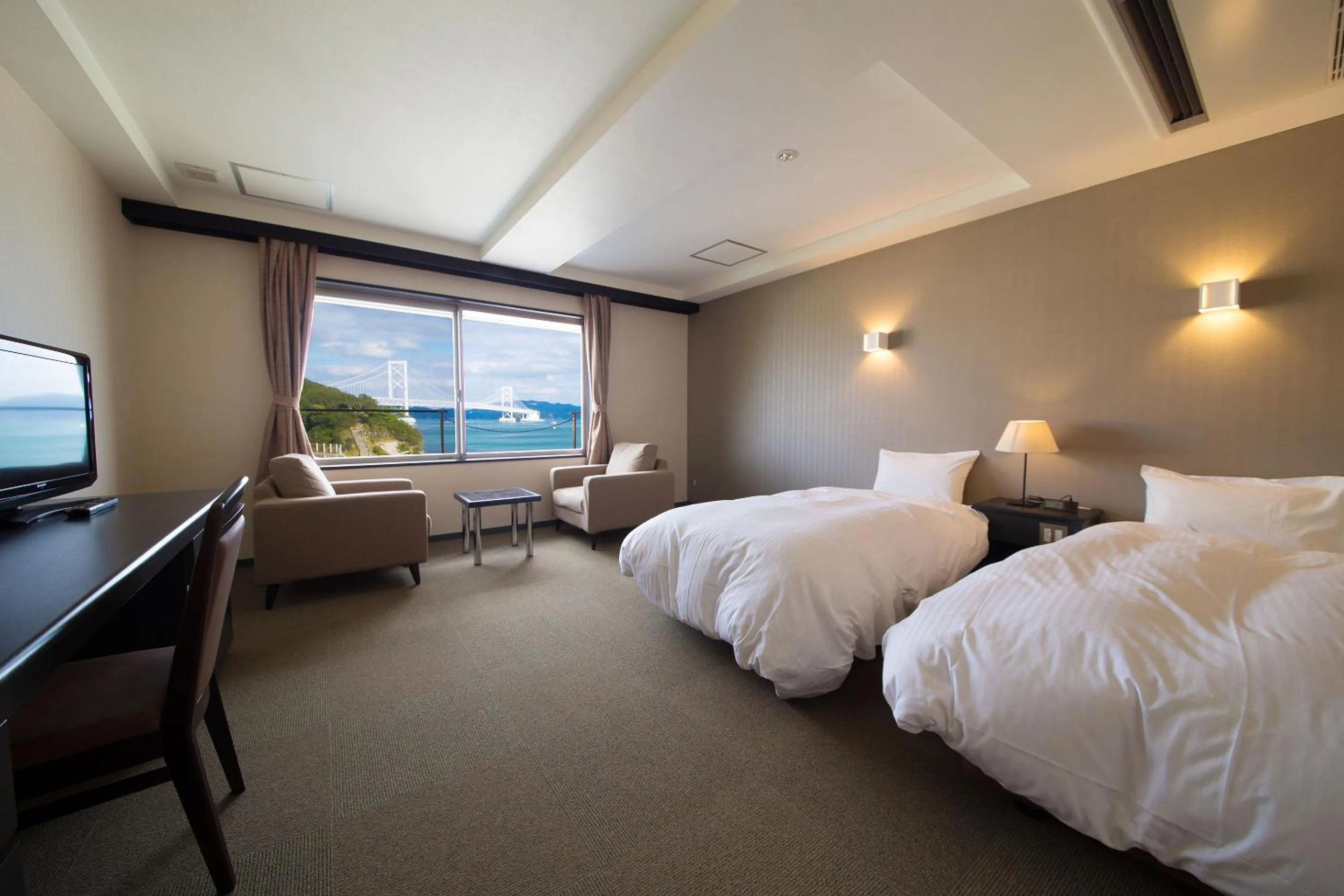 Photo of the whole room, Bed in Seaside Hotel Taimaru Kaigetsu