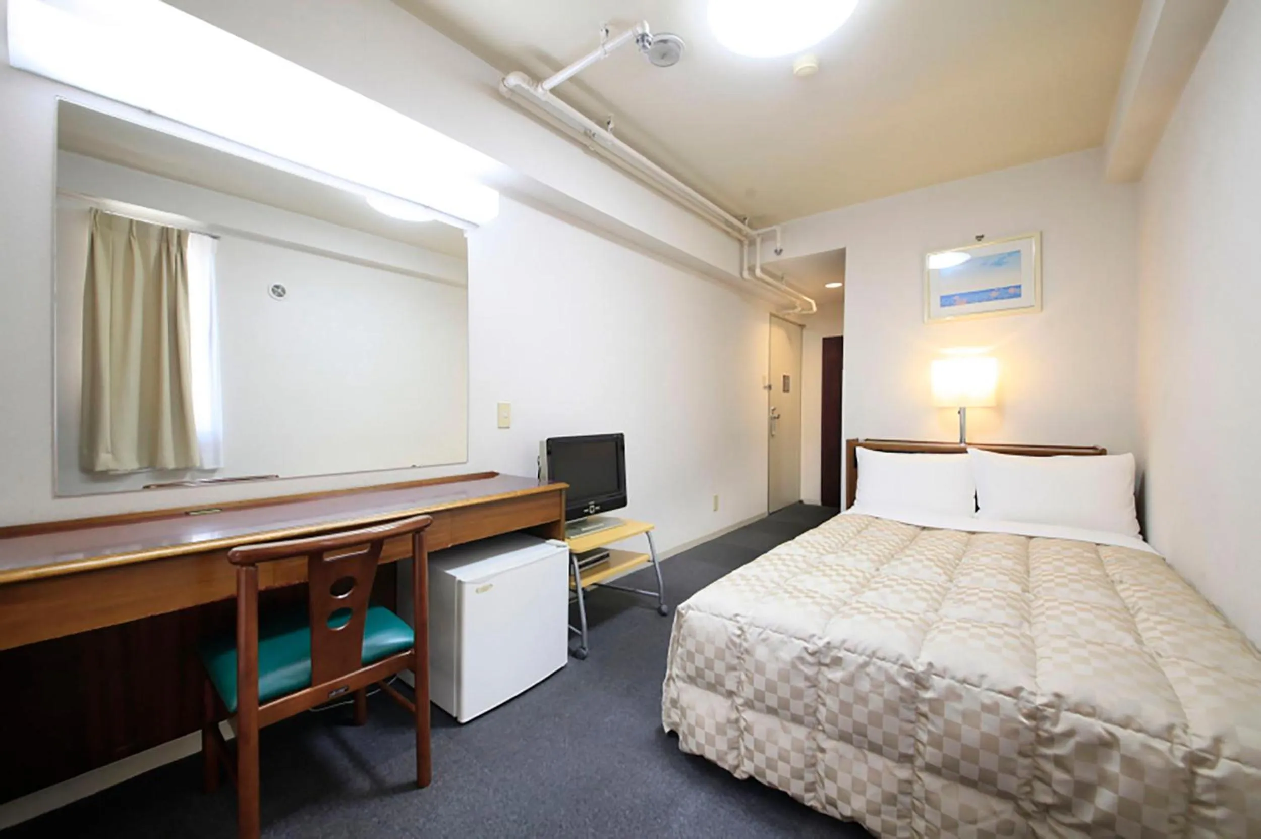 Bed in Shinjuku Urban Hotel