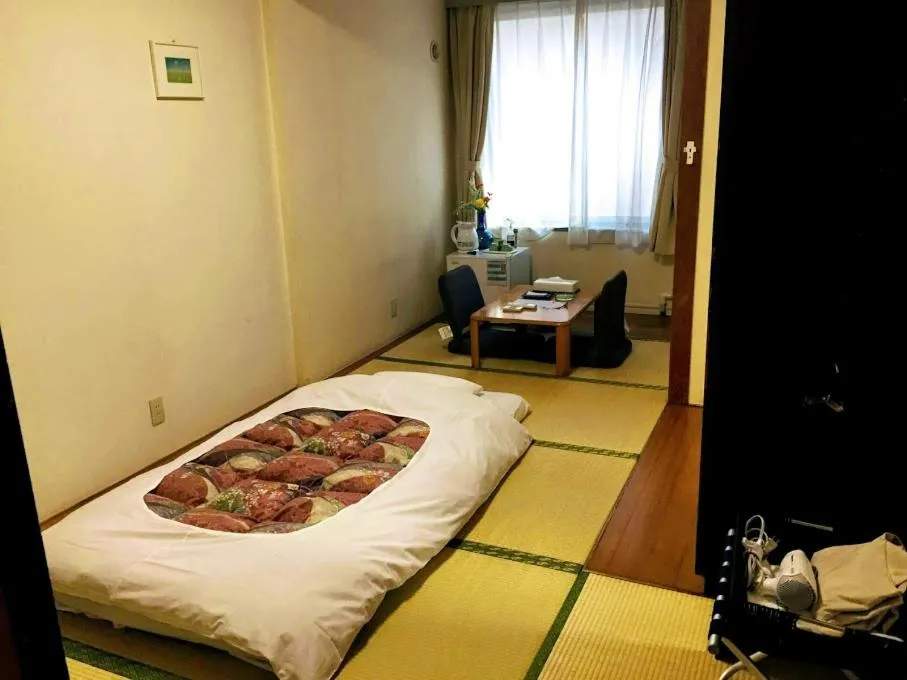 Bed in Shinjuku Urban Hotel