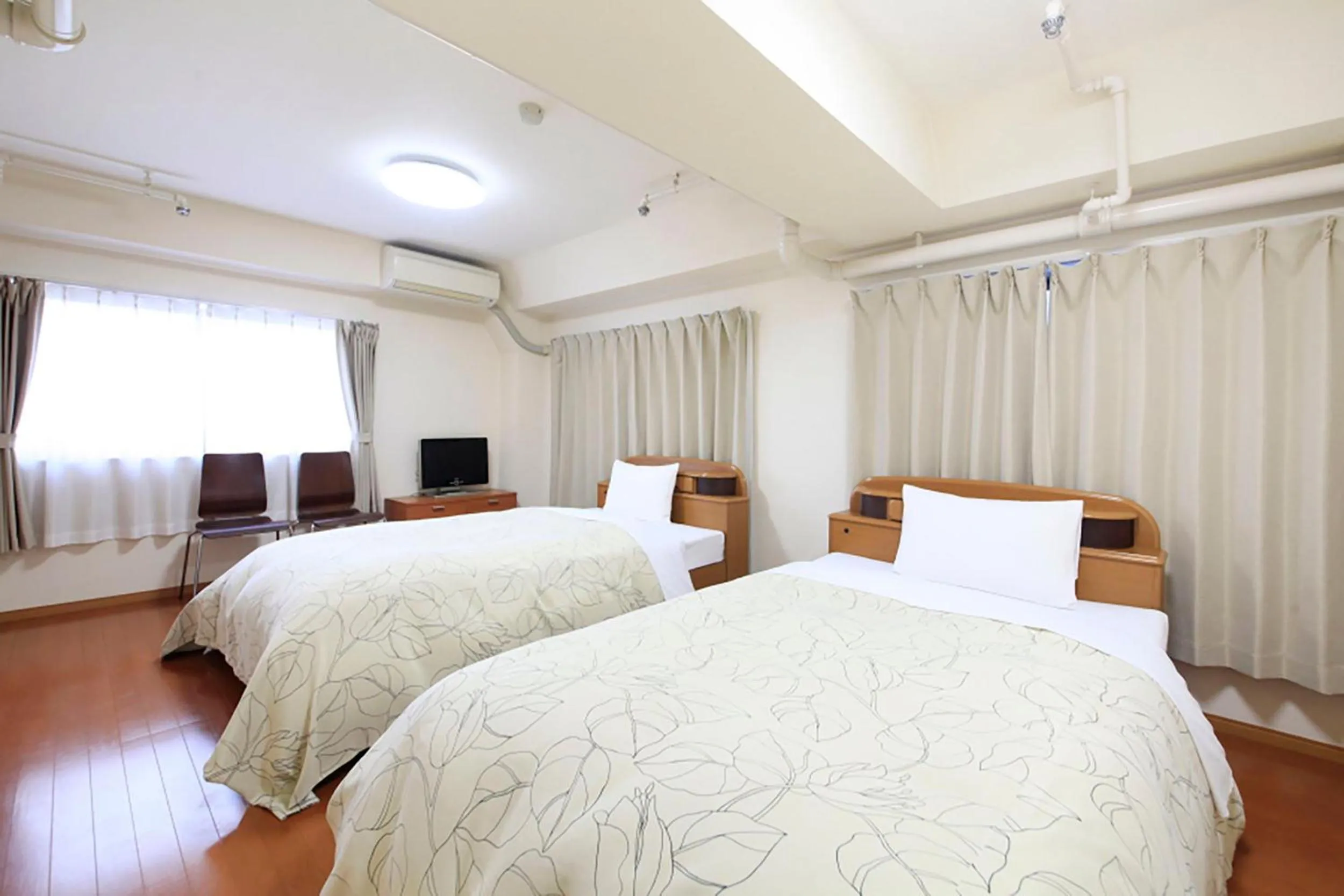 Bed in Shinjuku Urban Hotel