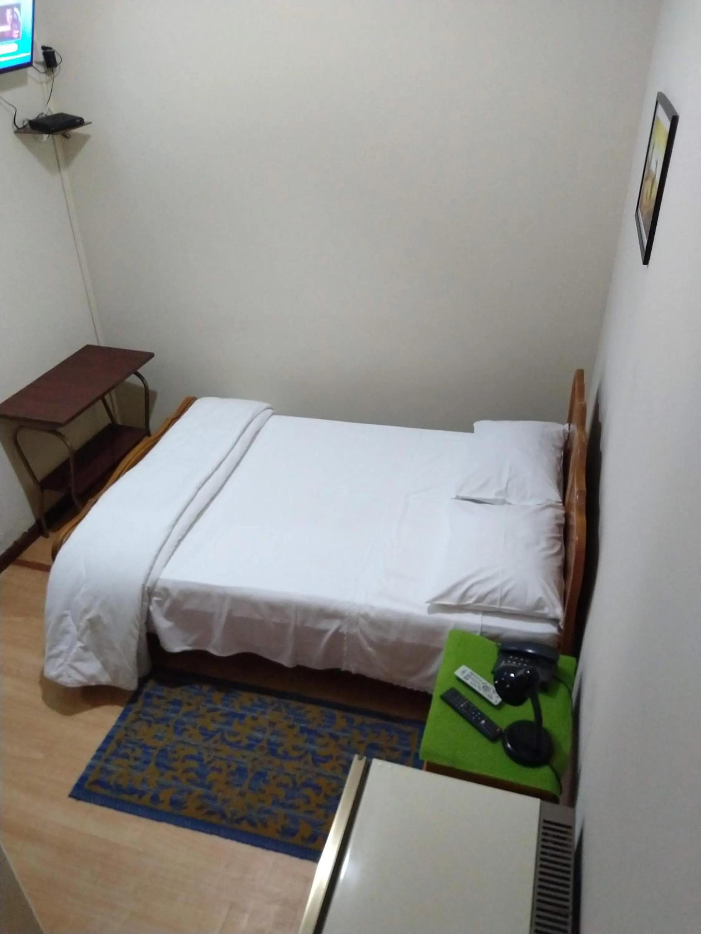 Bed in Hotel Cervantes