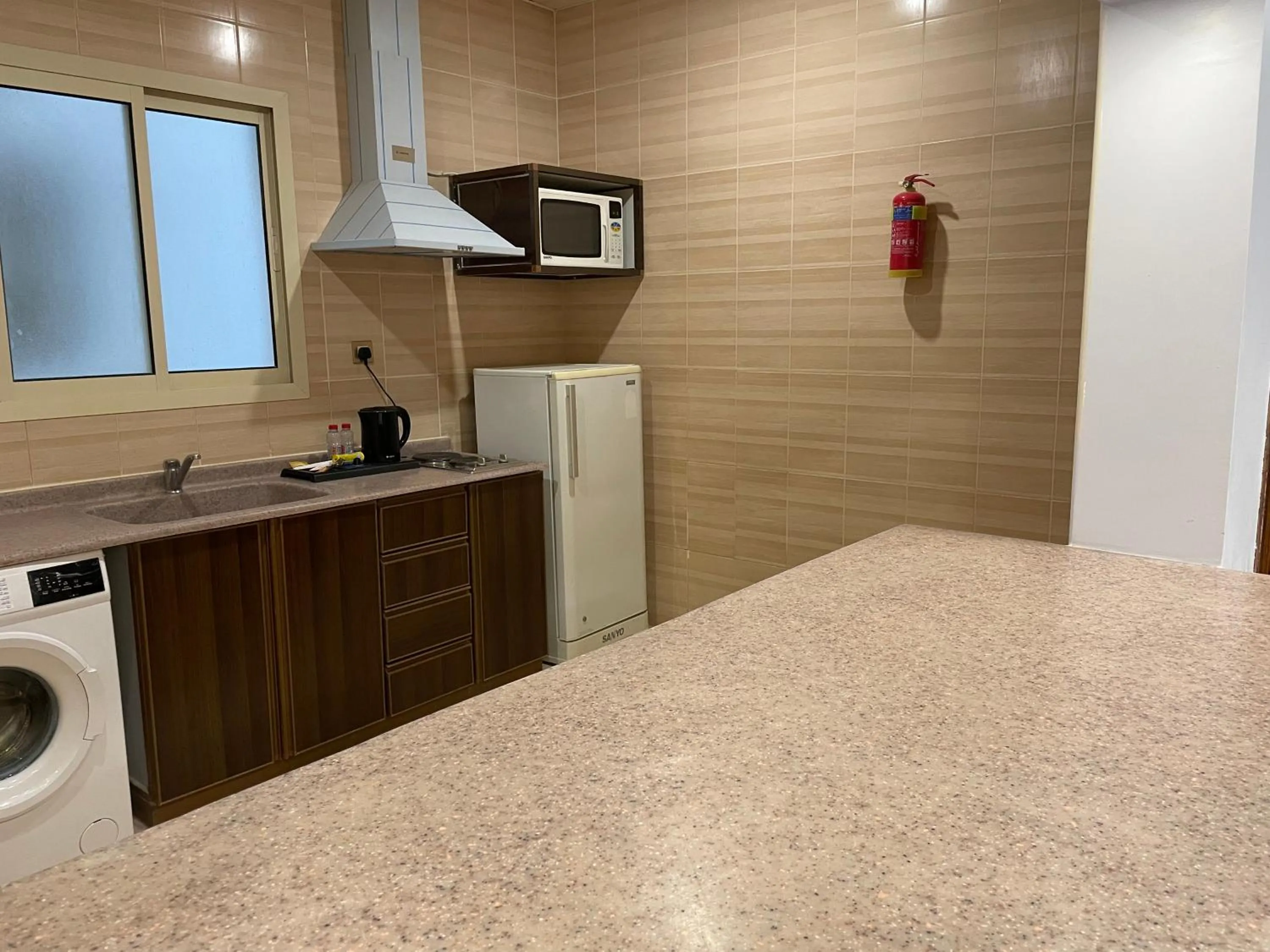 kitchen in Travellerinn Serviced Apartment