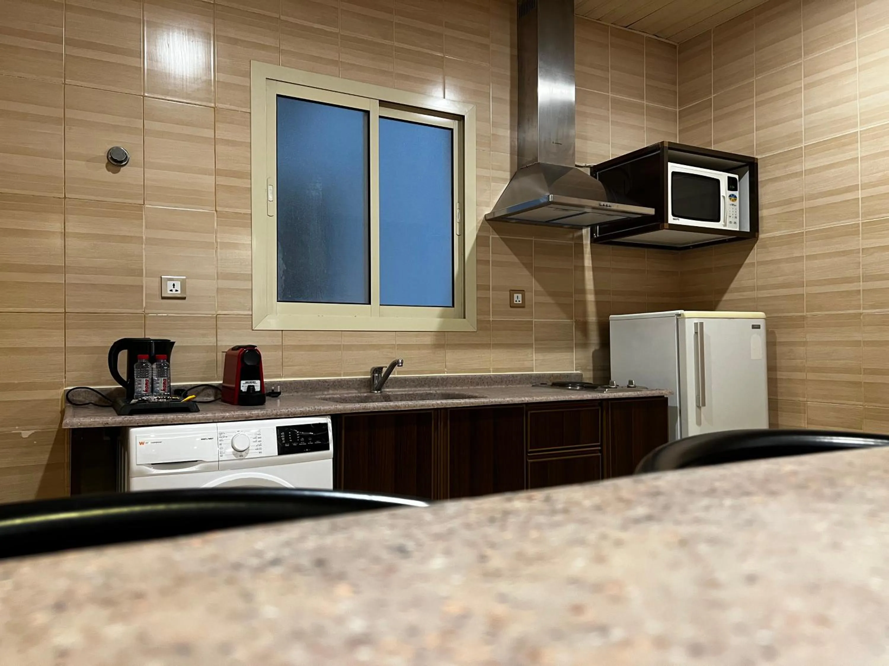 kitchen in Travellerinn Serviced Apartment