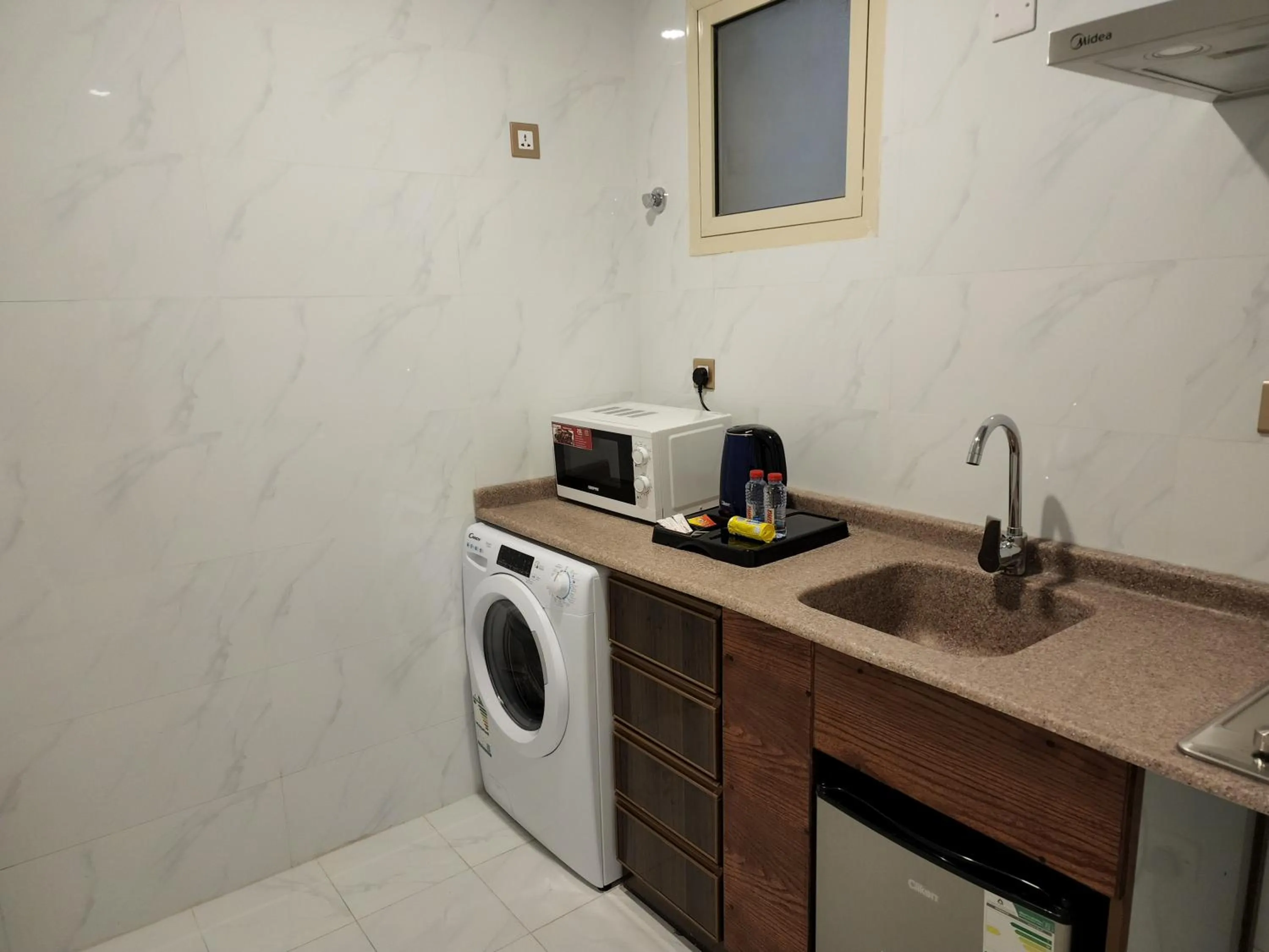 Kitchen or kitchenette in Travellerinn Serviced Apartment