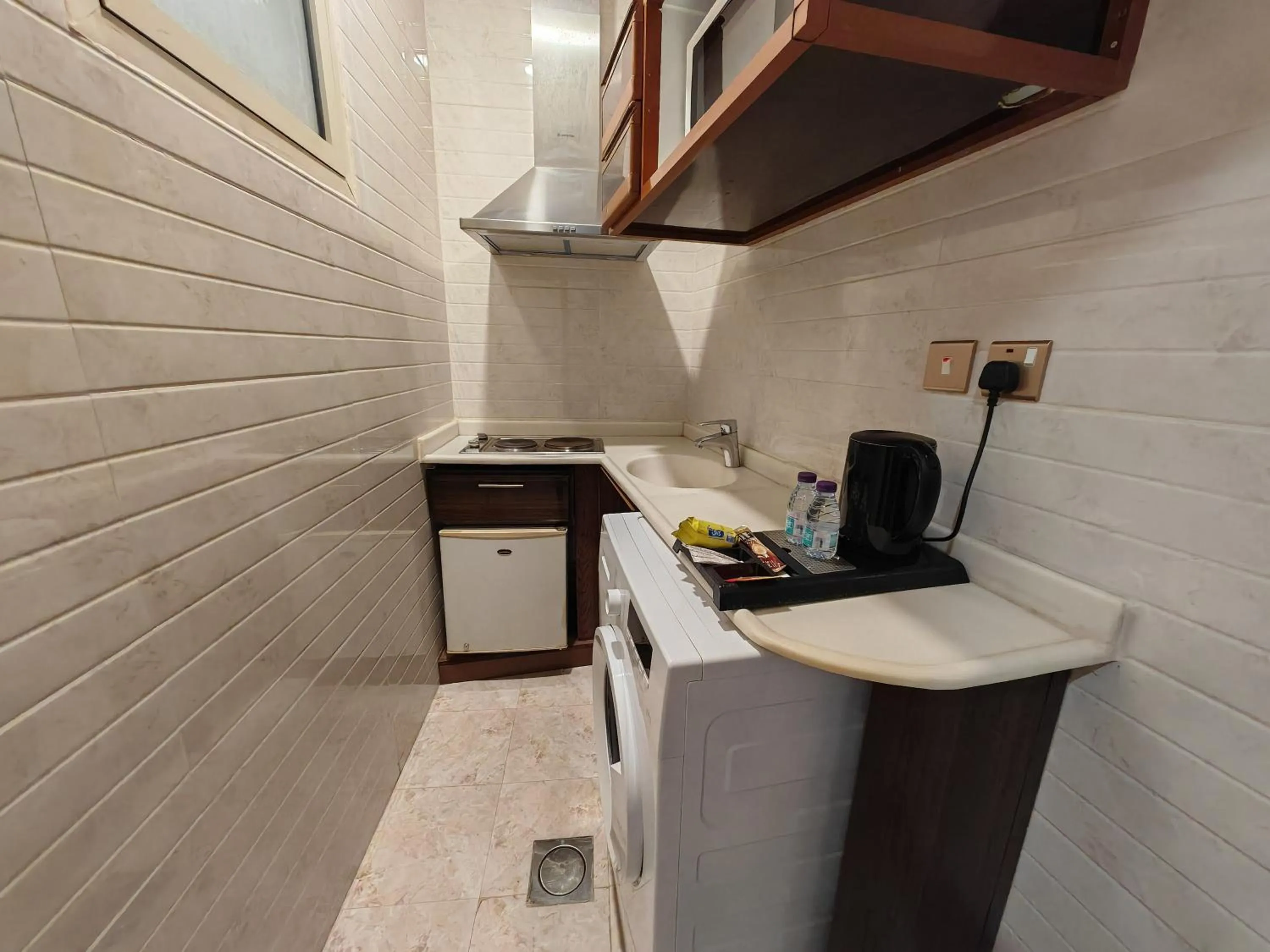 Kitchen or kitchenette in Travellerinn Serviced Apartment