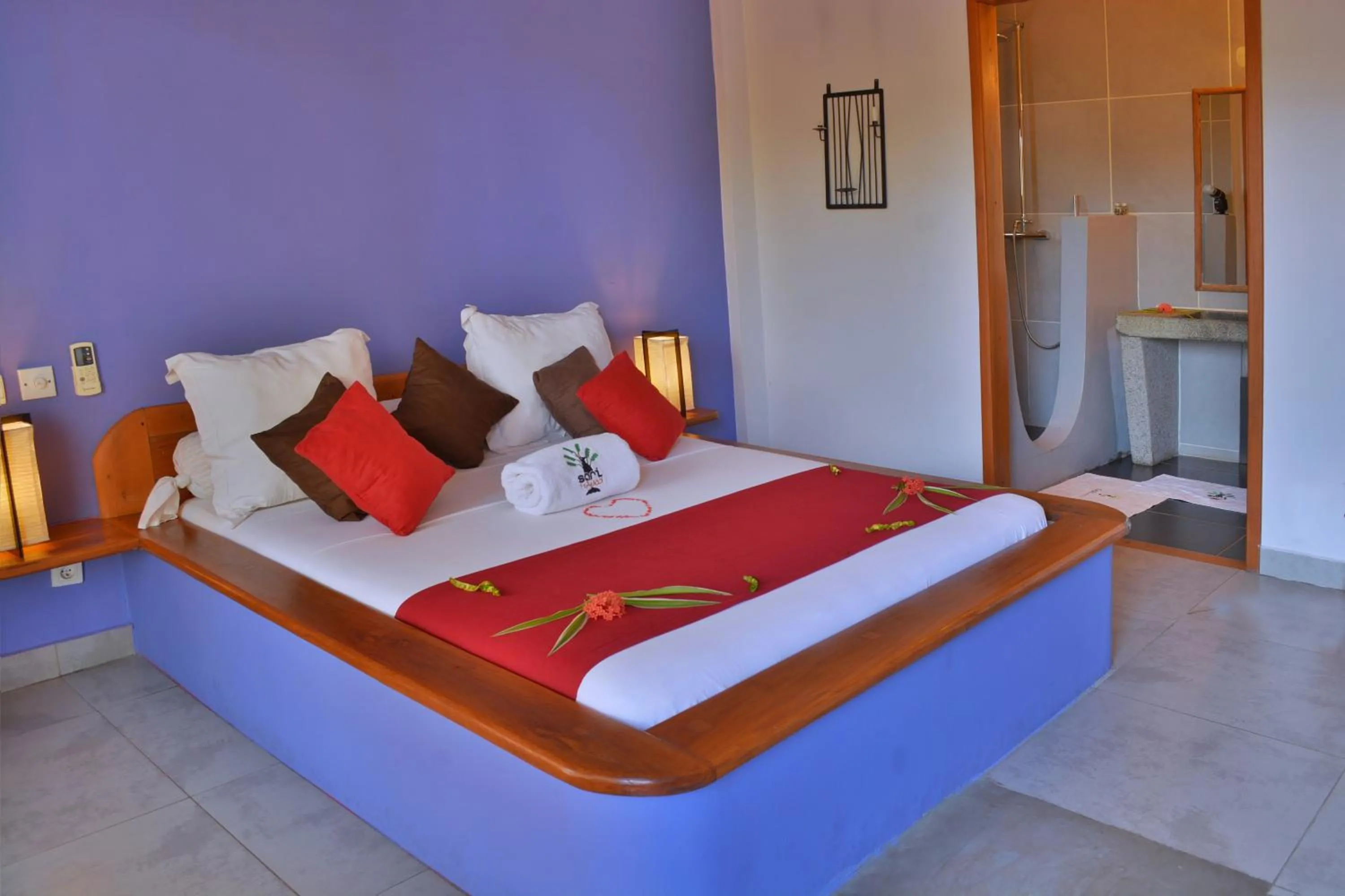 Bed in Hôtel Sarimanok