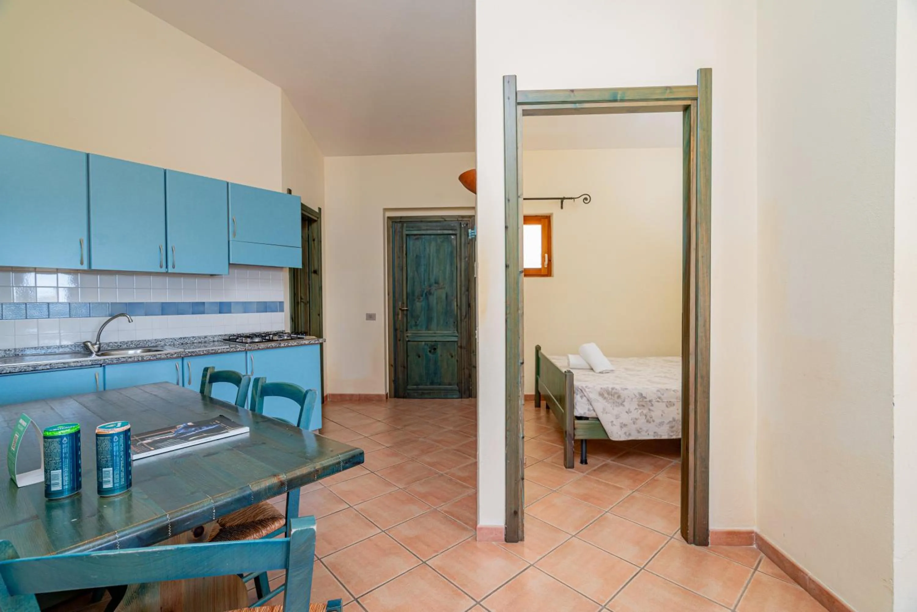 Kitchen or kitchenette, Bed in Club Esse Residence Capo D'orso