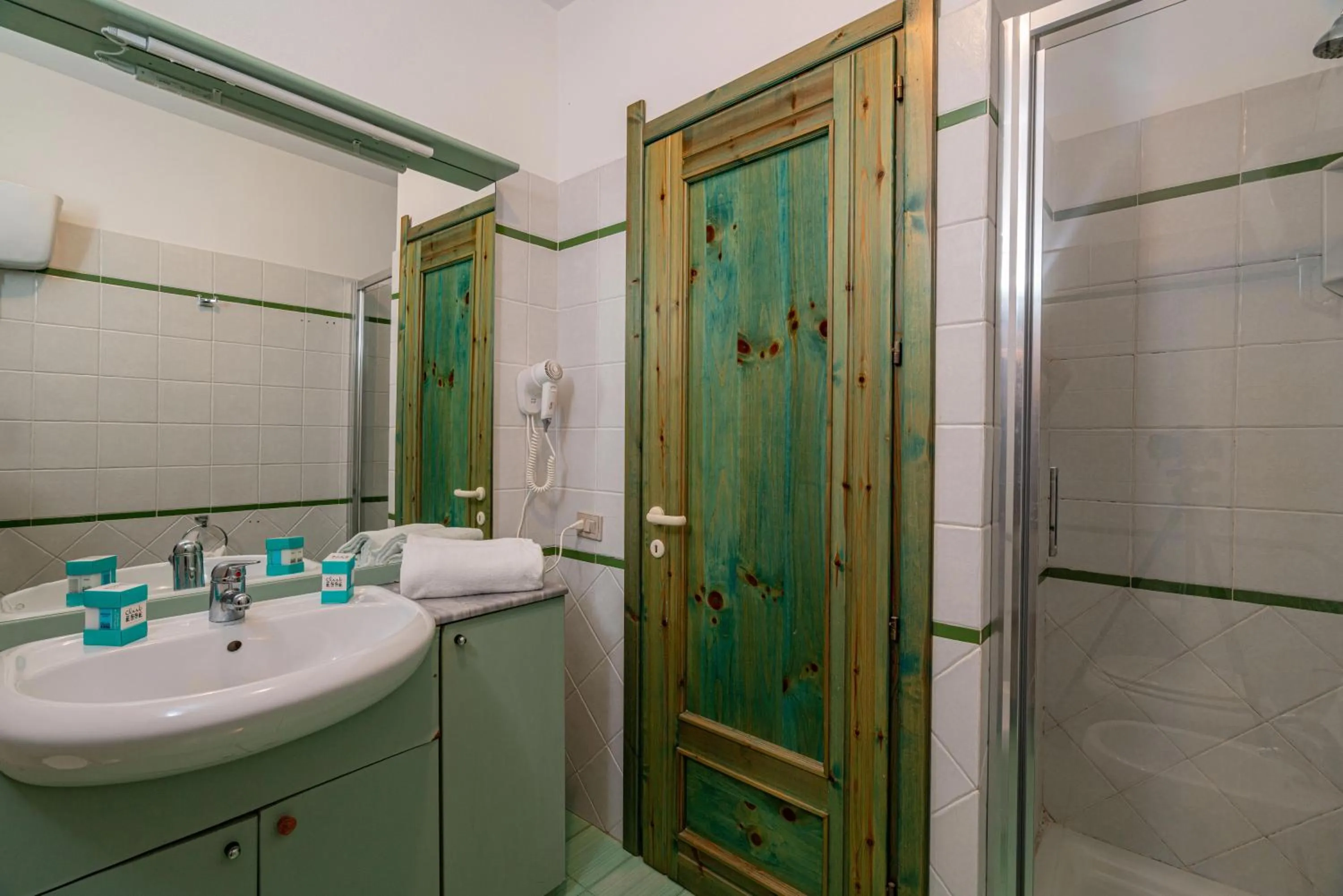 Bathroom in Club Esse Residence Capo D'orso