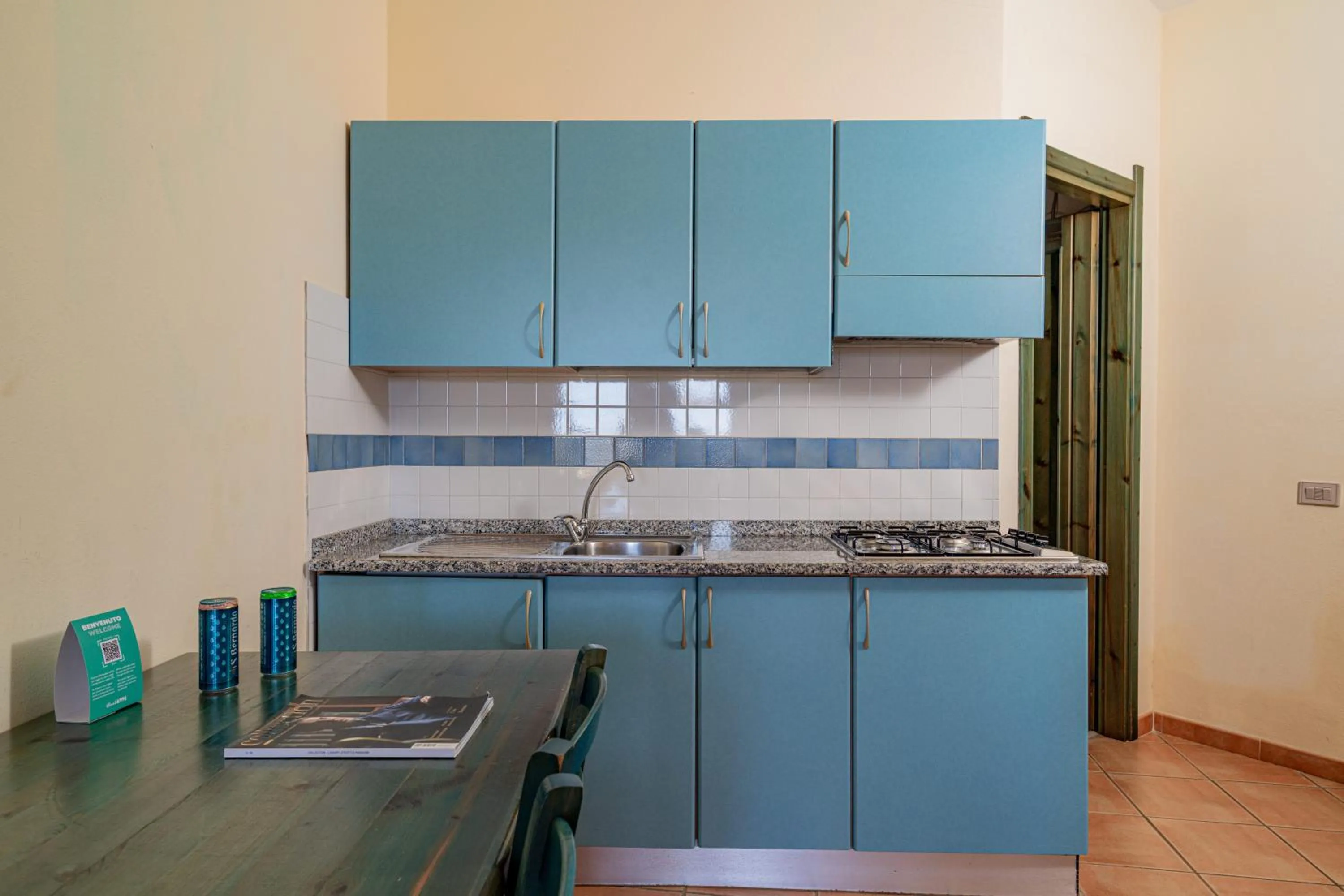 Kitchen or kitchenette in Club Esse Residence Capo D'orso