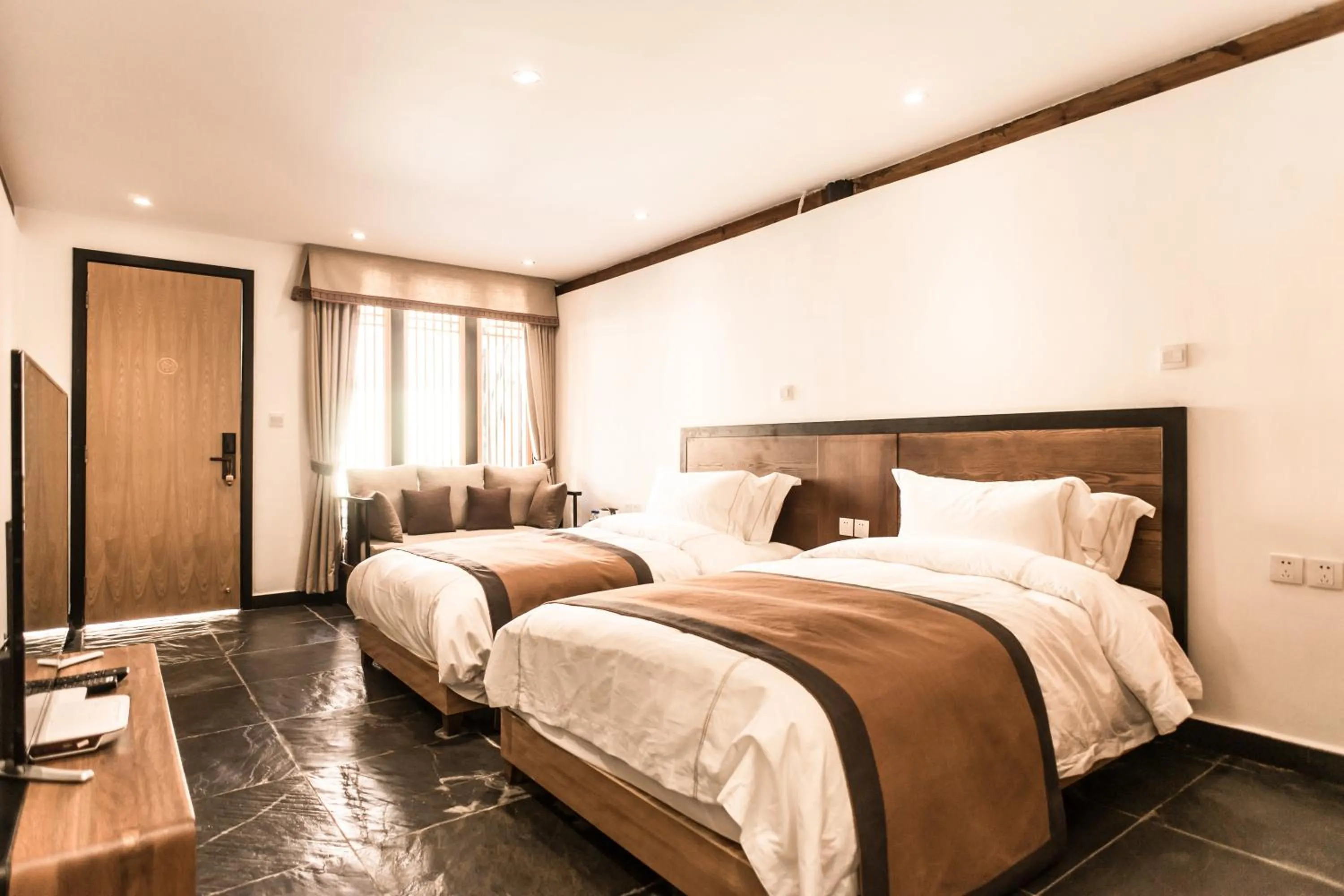 Bed in Dali Shaxi Qing Jing Courtyard
