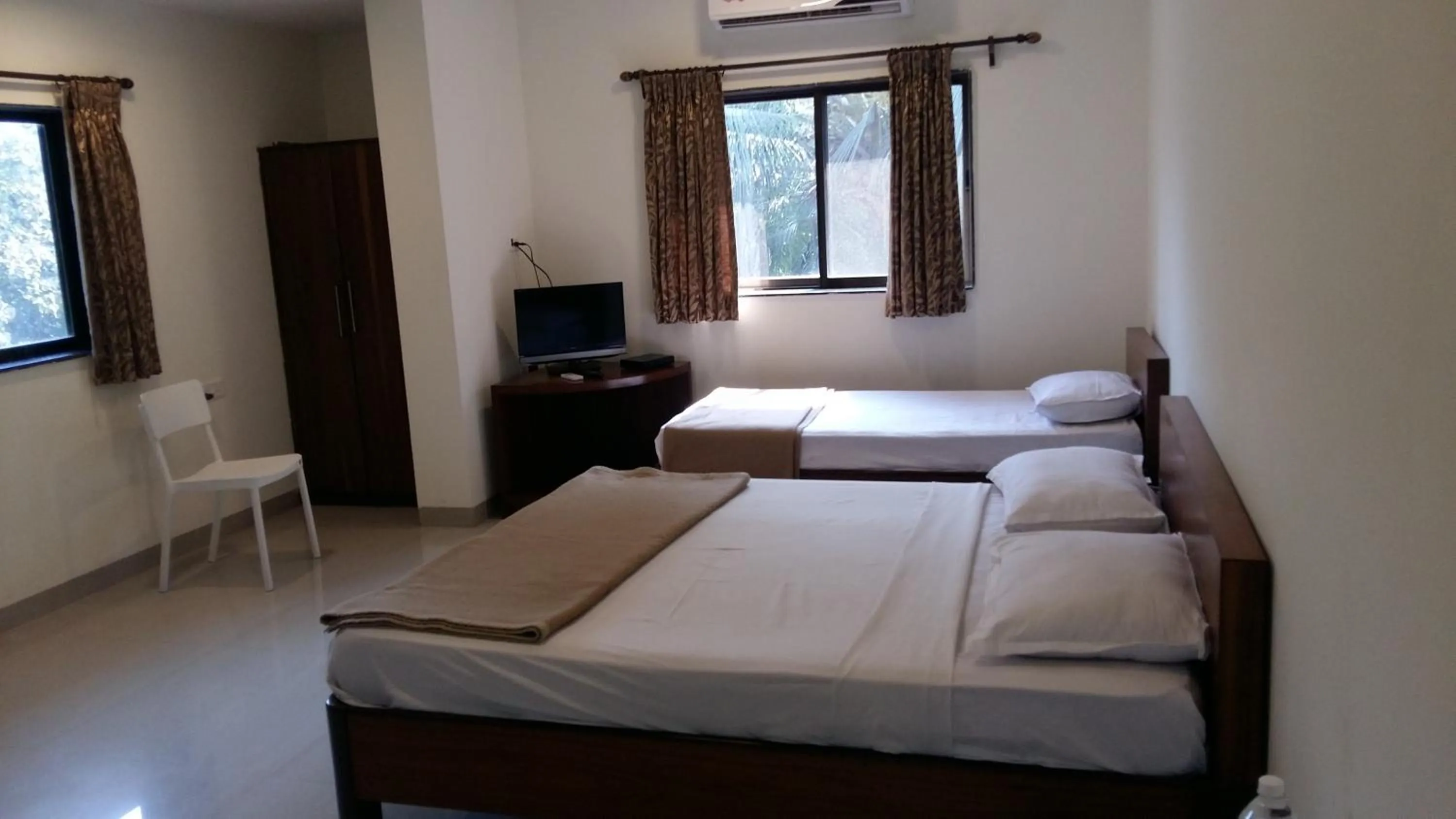 Bed in Paradise Villas & Resort