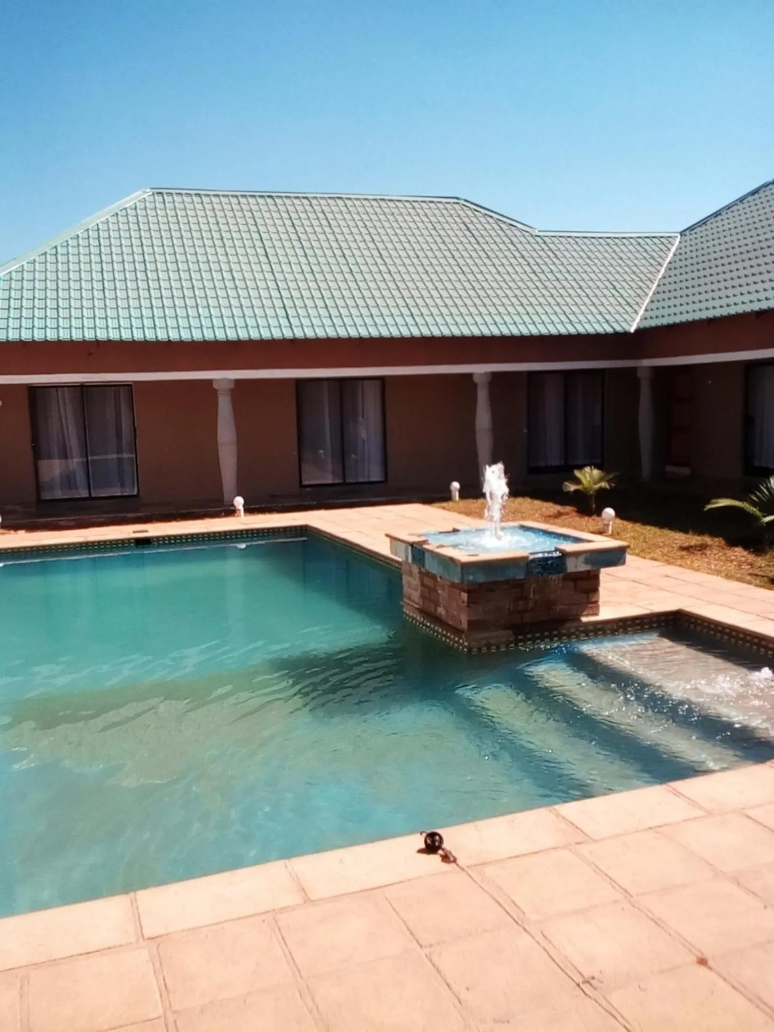 Pool view in Royal Olympia Lodges and Safaris Livingstone