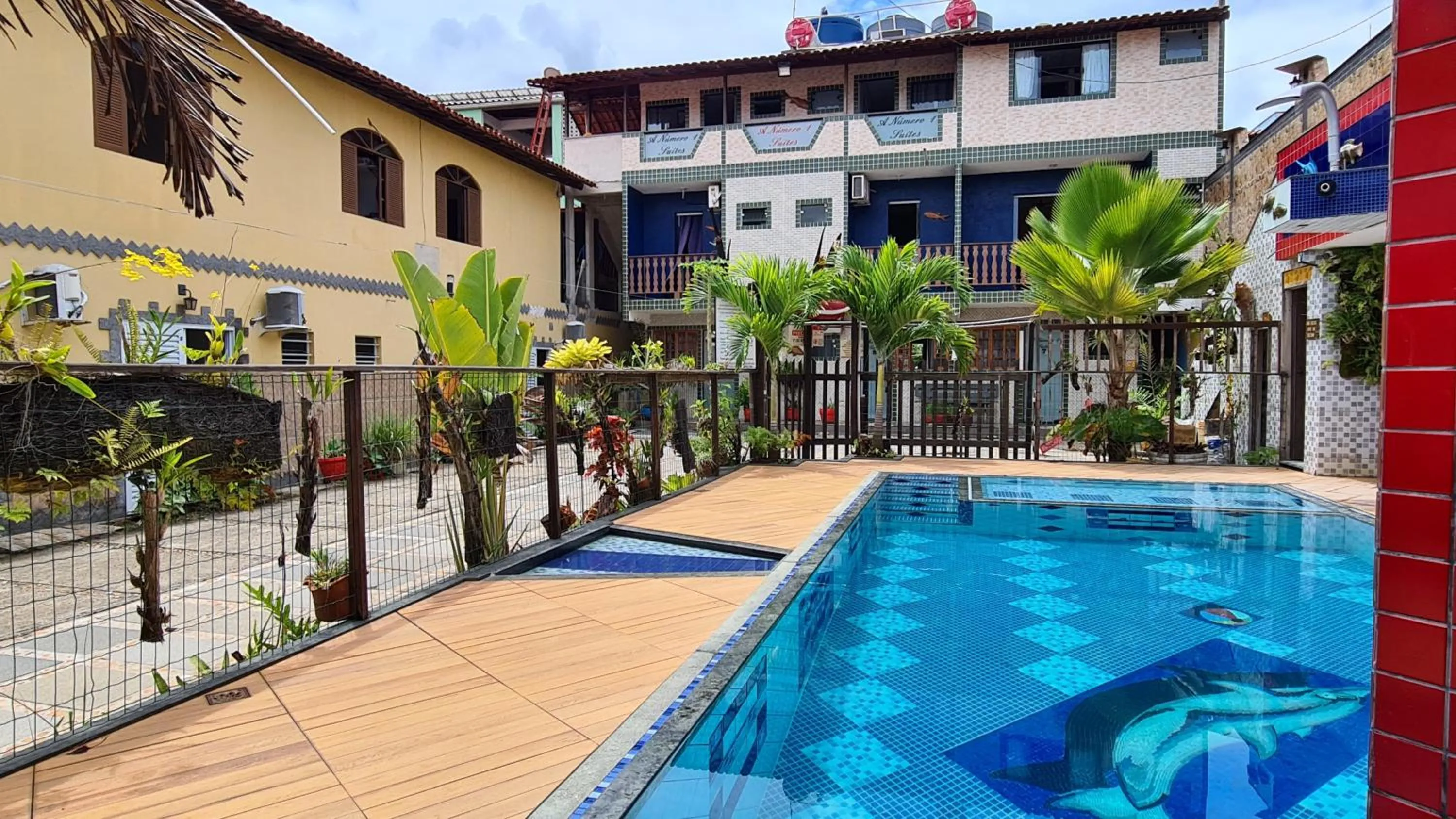 Swimming pool in A Número 1 Suítes - Praia do Morro