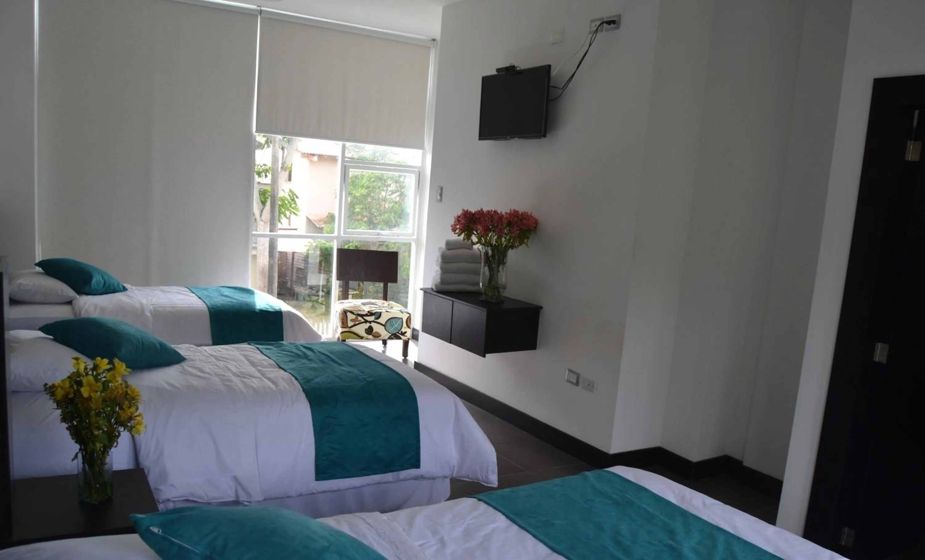 Photo of the whole room, Bed in Ocean Blue Hotel