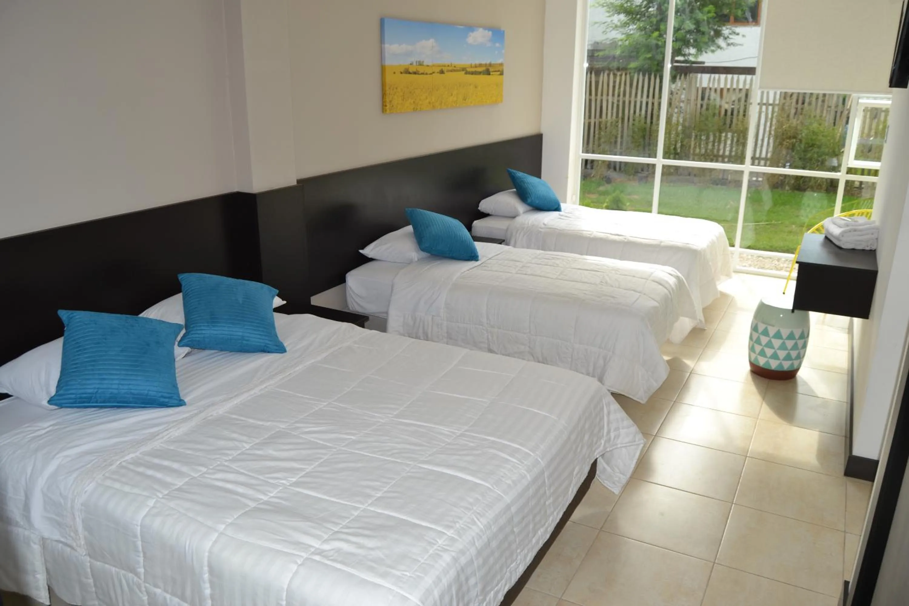 Photo of the whole room, Bed in Ocean Blue Hotel