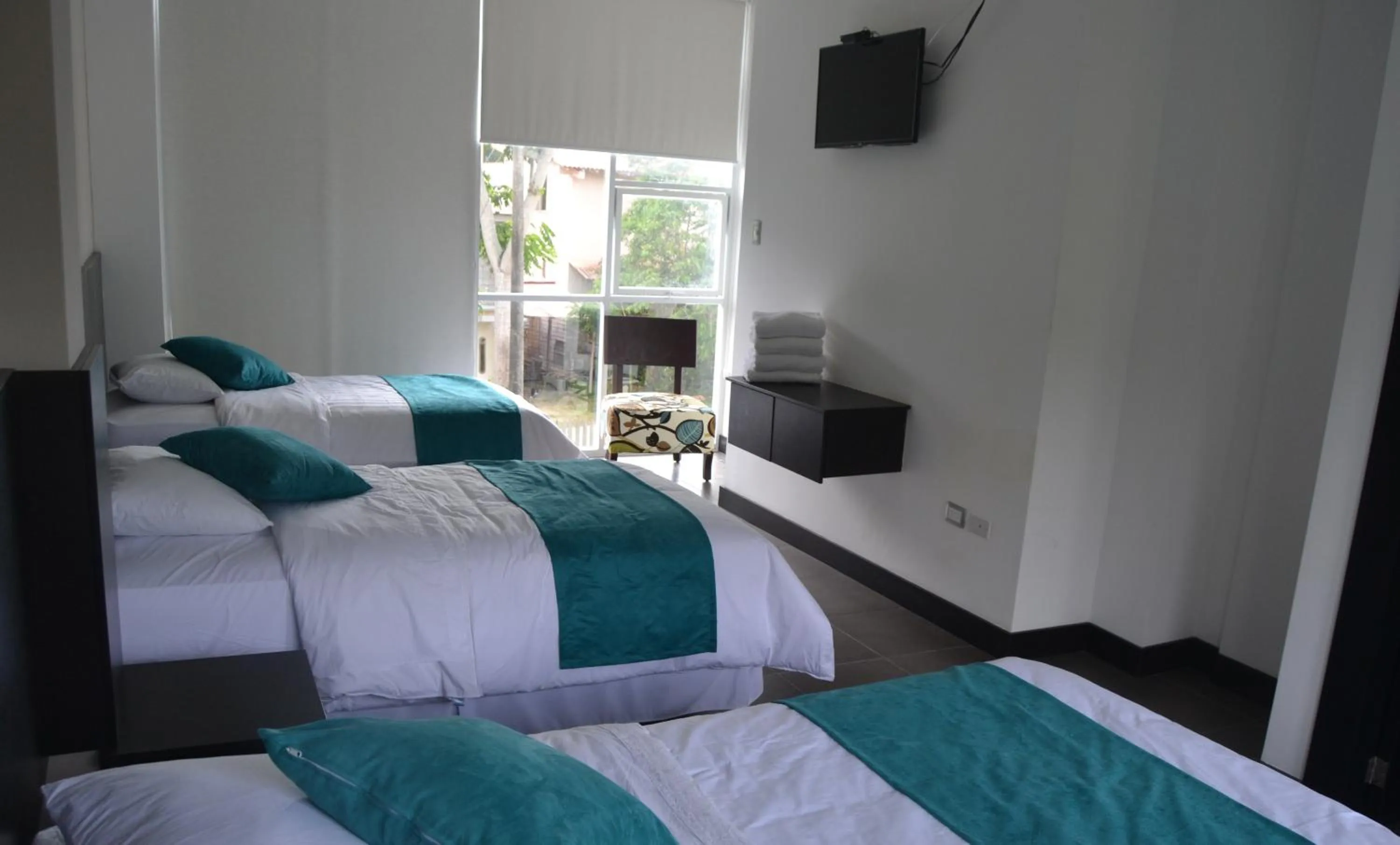 Photo of the whole room, Bed in Ocean Blue Hotel