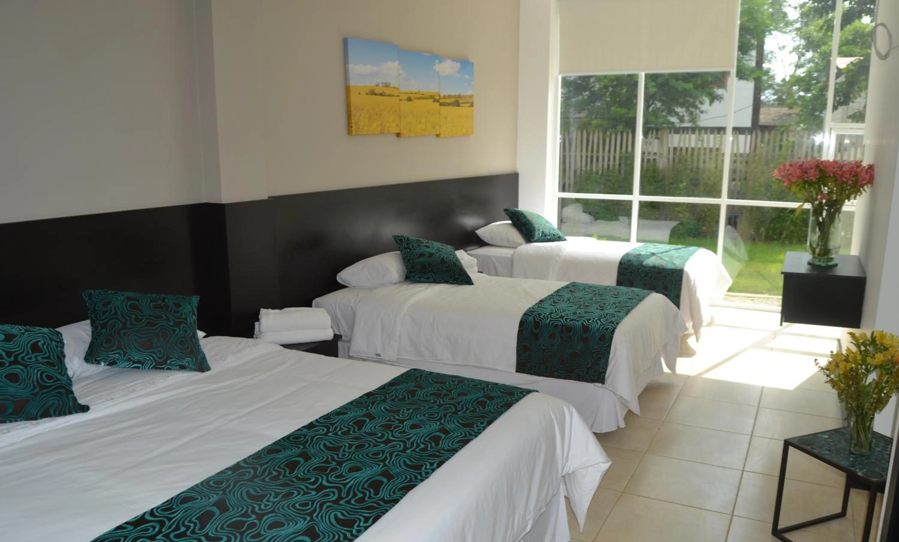 Photo of the whole room, Bed in Ocean Blue Hotel