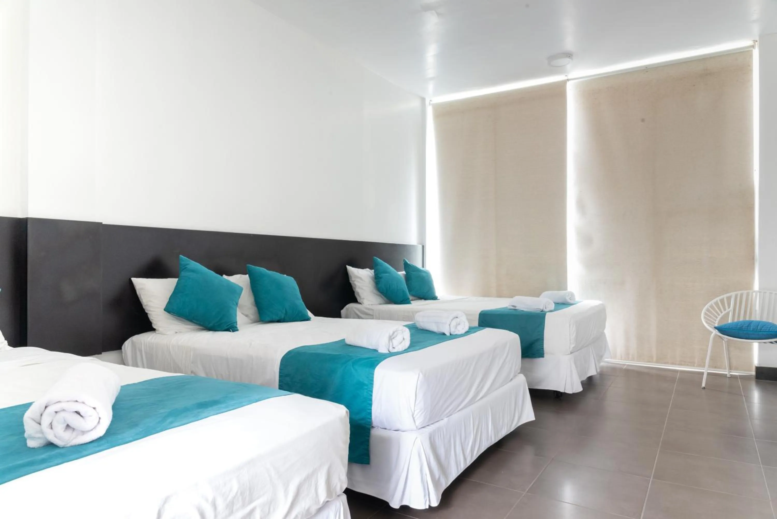 Photo of the whole room, Bed in Ocean Blue Hotel