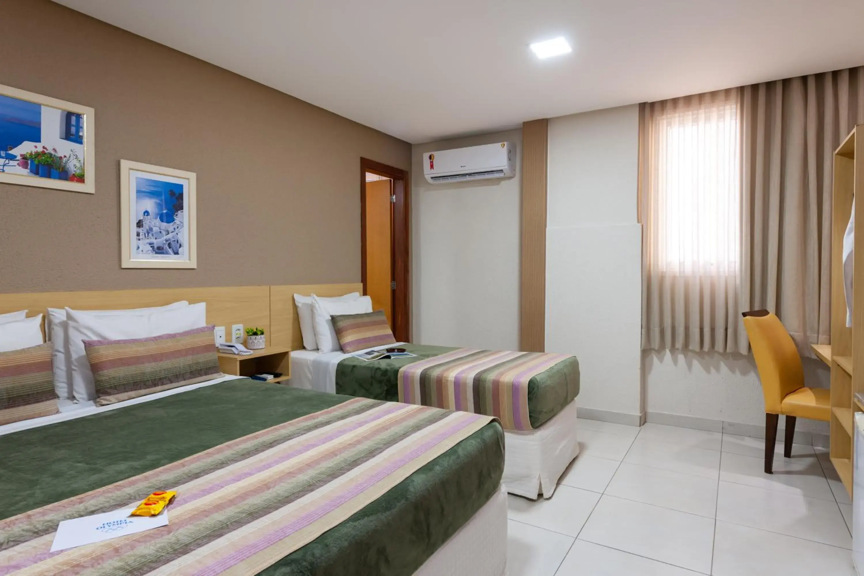 Master Triple Room (1 Double + 1 Single Bed) in Hotel Olympia Master Triple Room (1 Double + 1 Single Bed) in Hotel Olympia