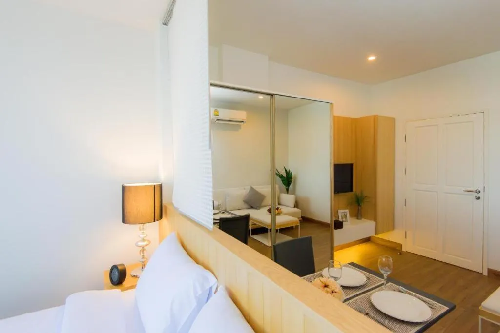 Living room, Bed in Hill Myna Condotel Official Account