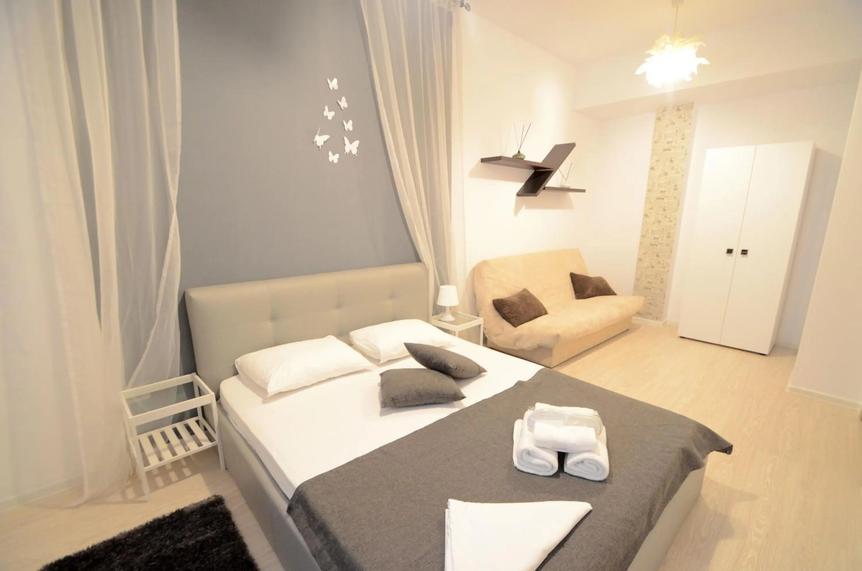 Bed in Uptown Residence Apartments