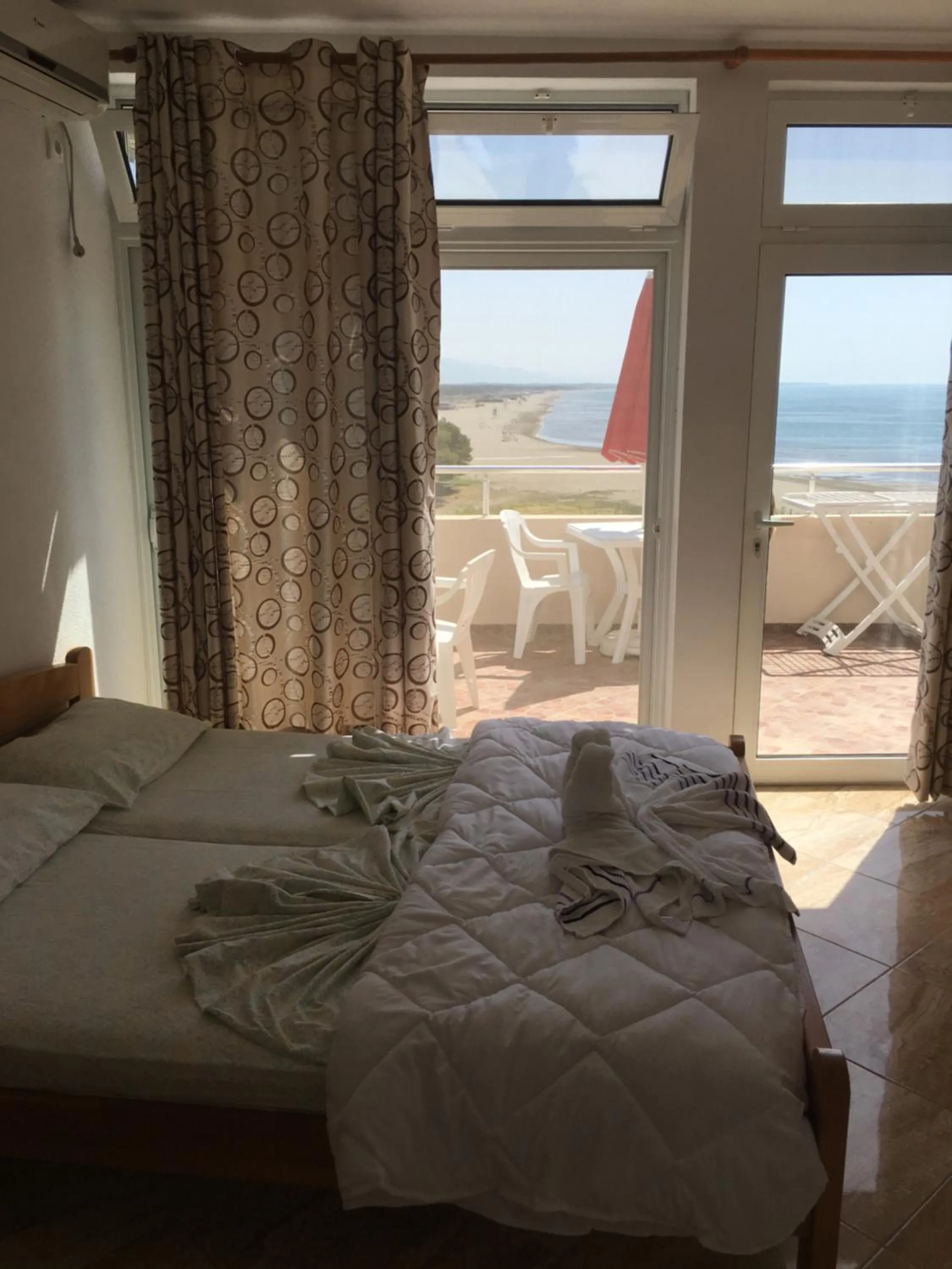 Photo of the whole room, Bed in Sand and Sea Apartments