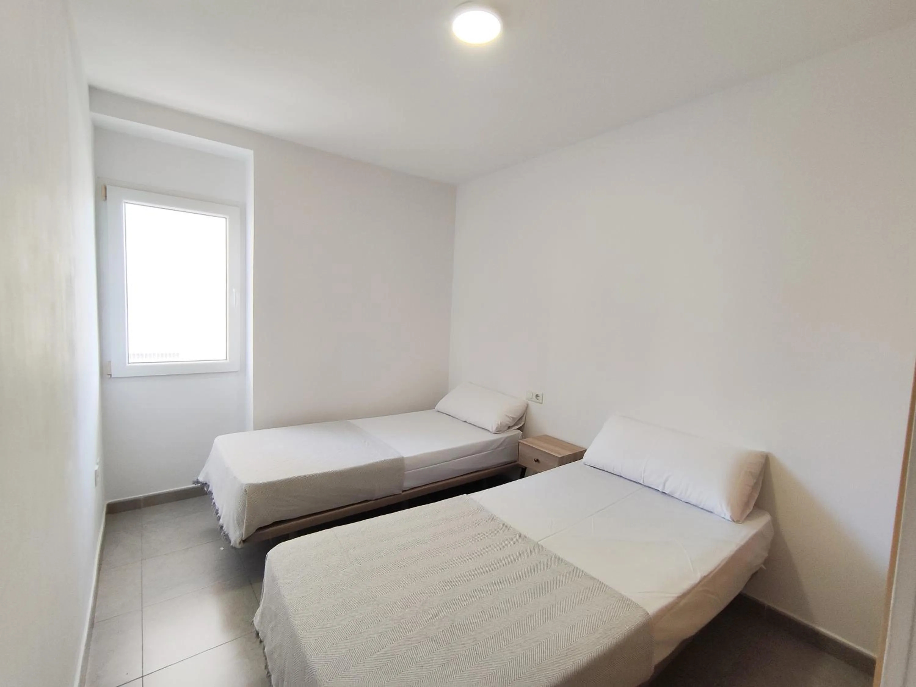 Bedroom, Bed in Apartamentos Gandía Centro 3000