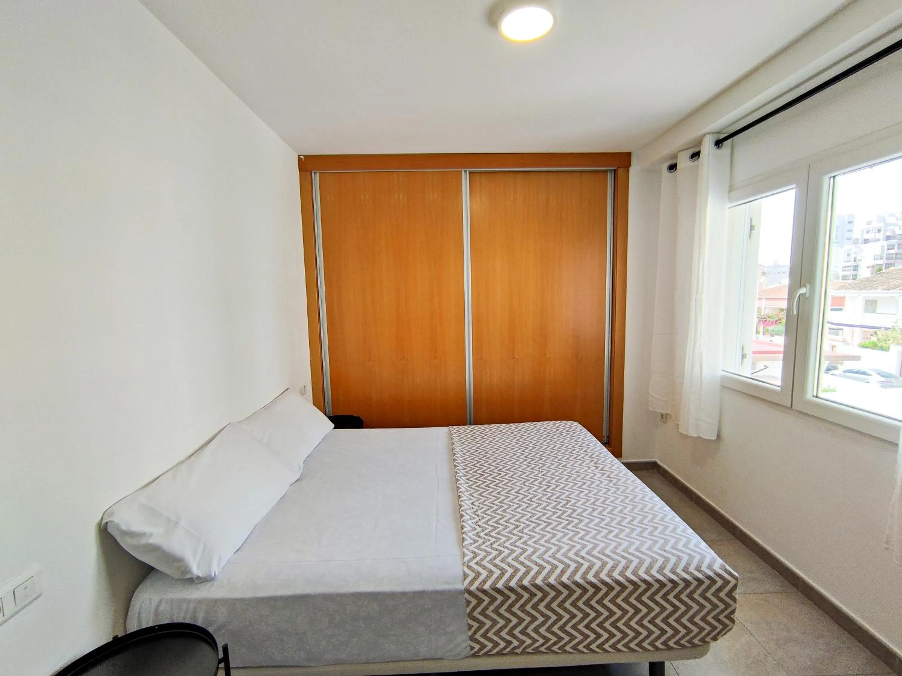 Bedroom, Bed in Apartamentos Gandía Centro 3000