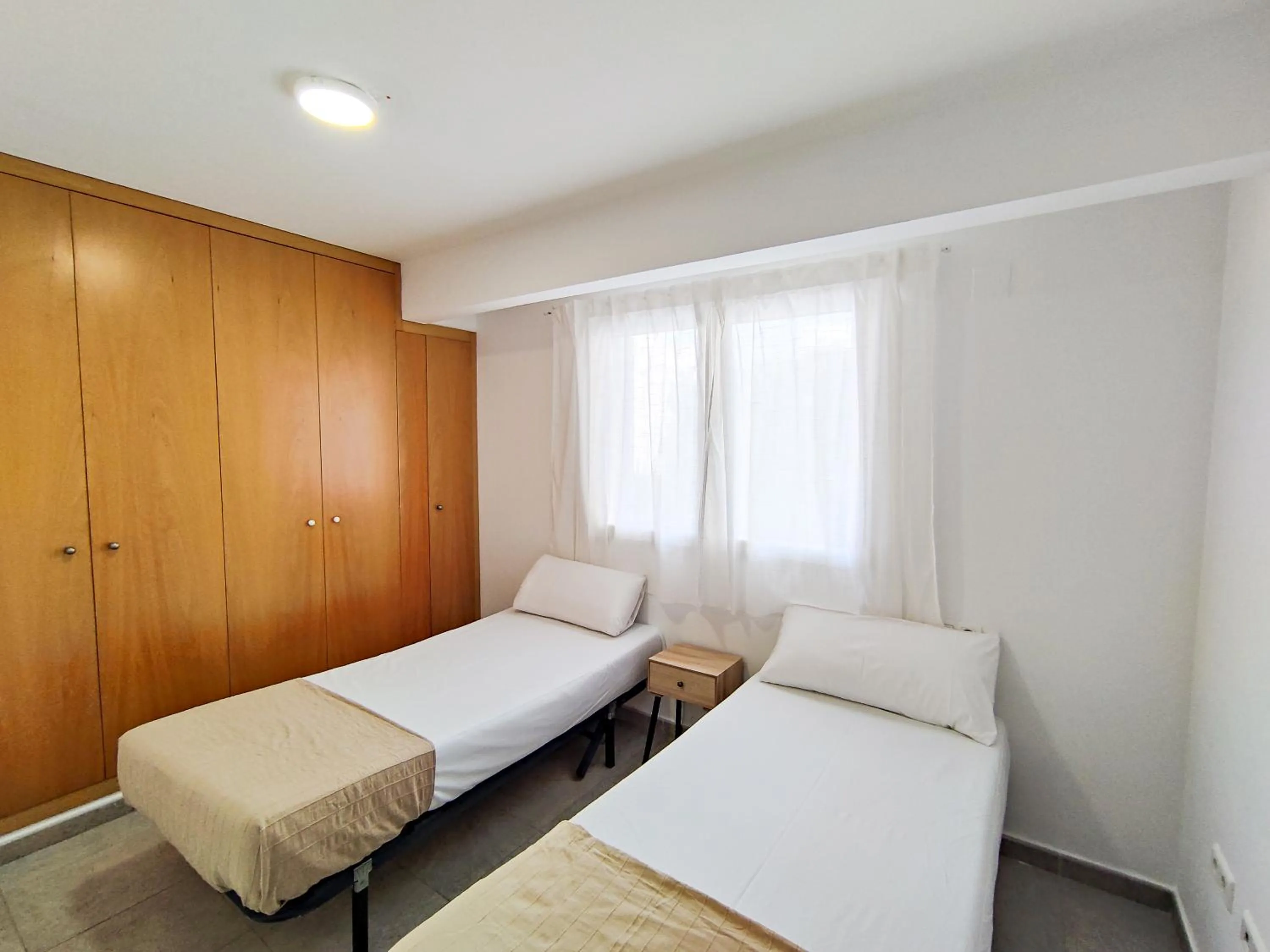 Bedroom, Bed in Apartamentos Gandía Centro 3000