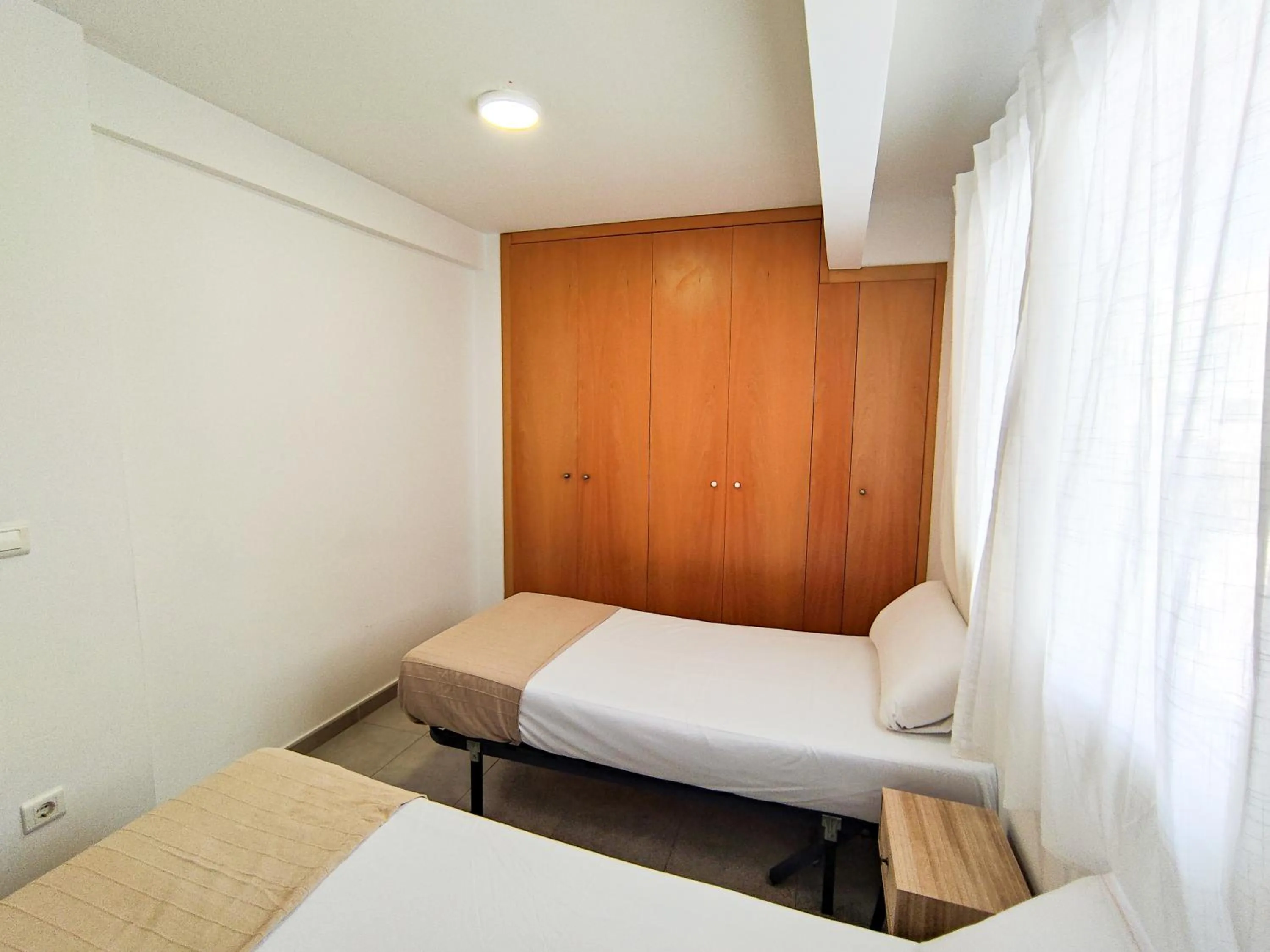 Bedroom, Bed in Apartamentos Gandía Centro 3000