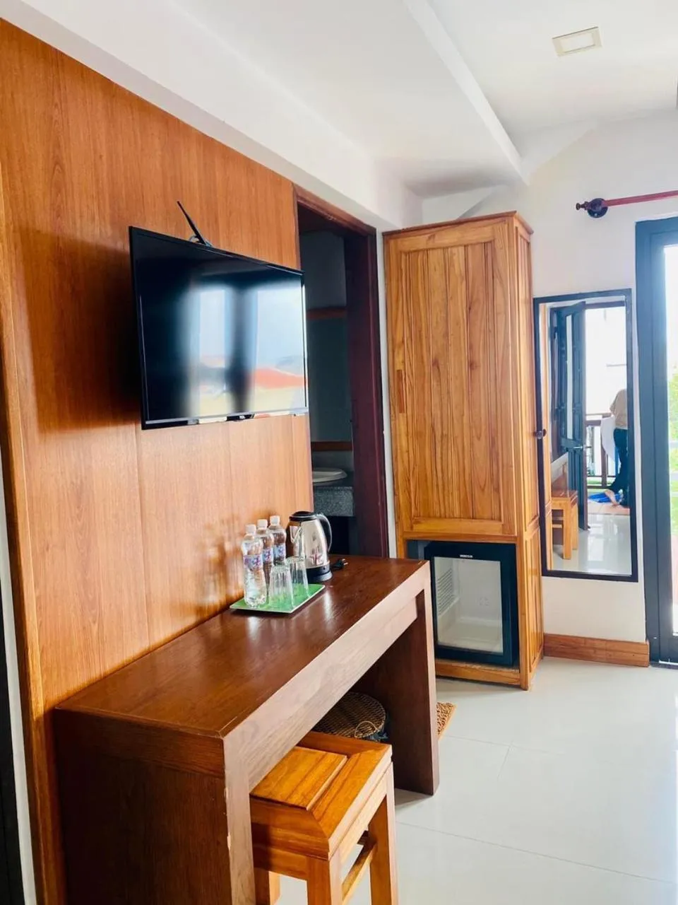 Communal lounge/ TV room in Riverside Plum Garden Villa