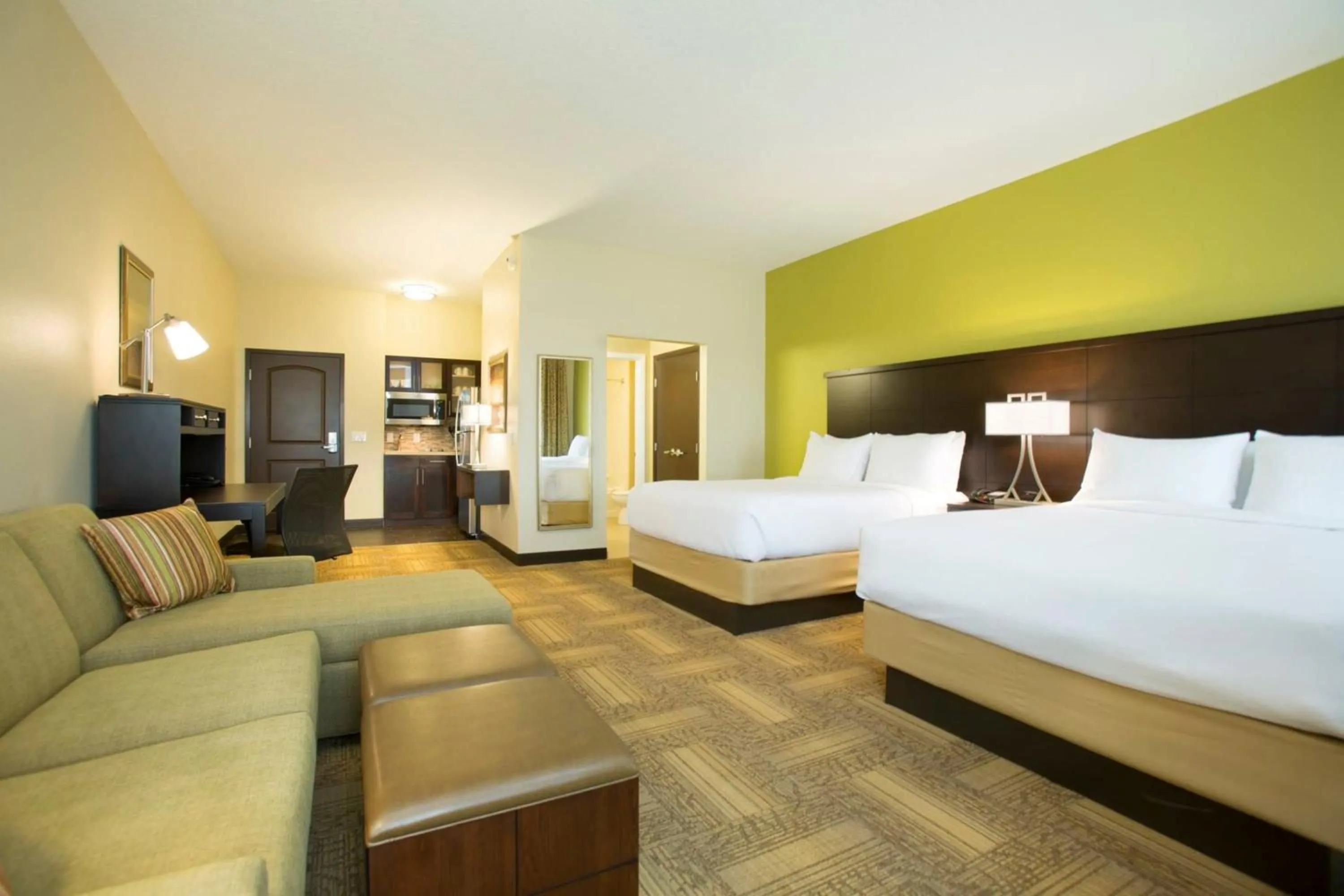 Photo of the whole room, Bed in Staybridge Suites Orlando at SeaWorld by IHG - Free Breakfast & Shuttle to SeaWorld Parks