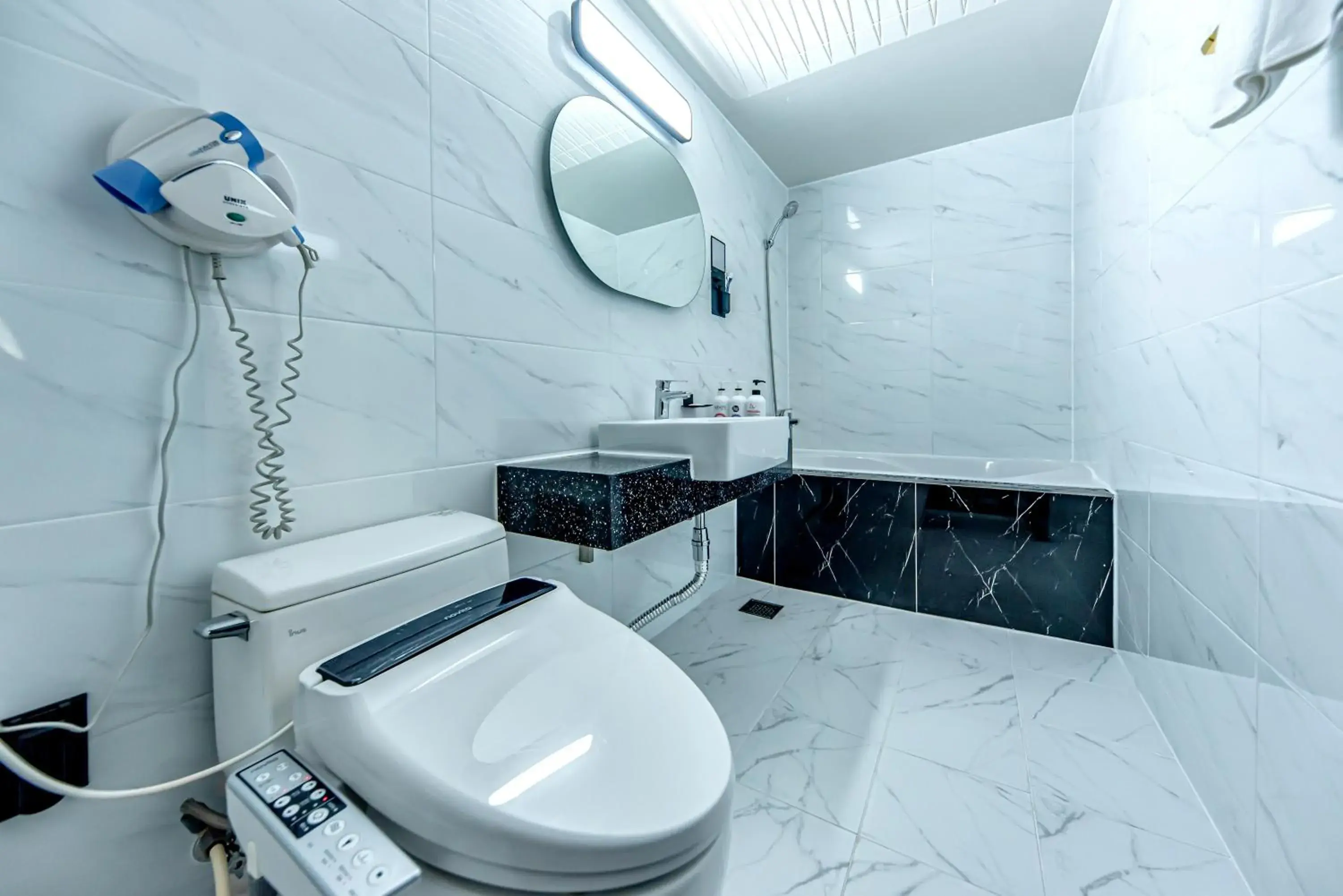 Bathroom in HS Tourist Hotel Bathroom in HS Tourist Hotel