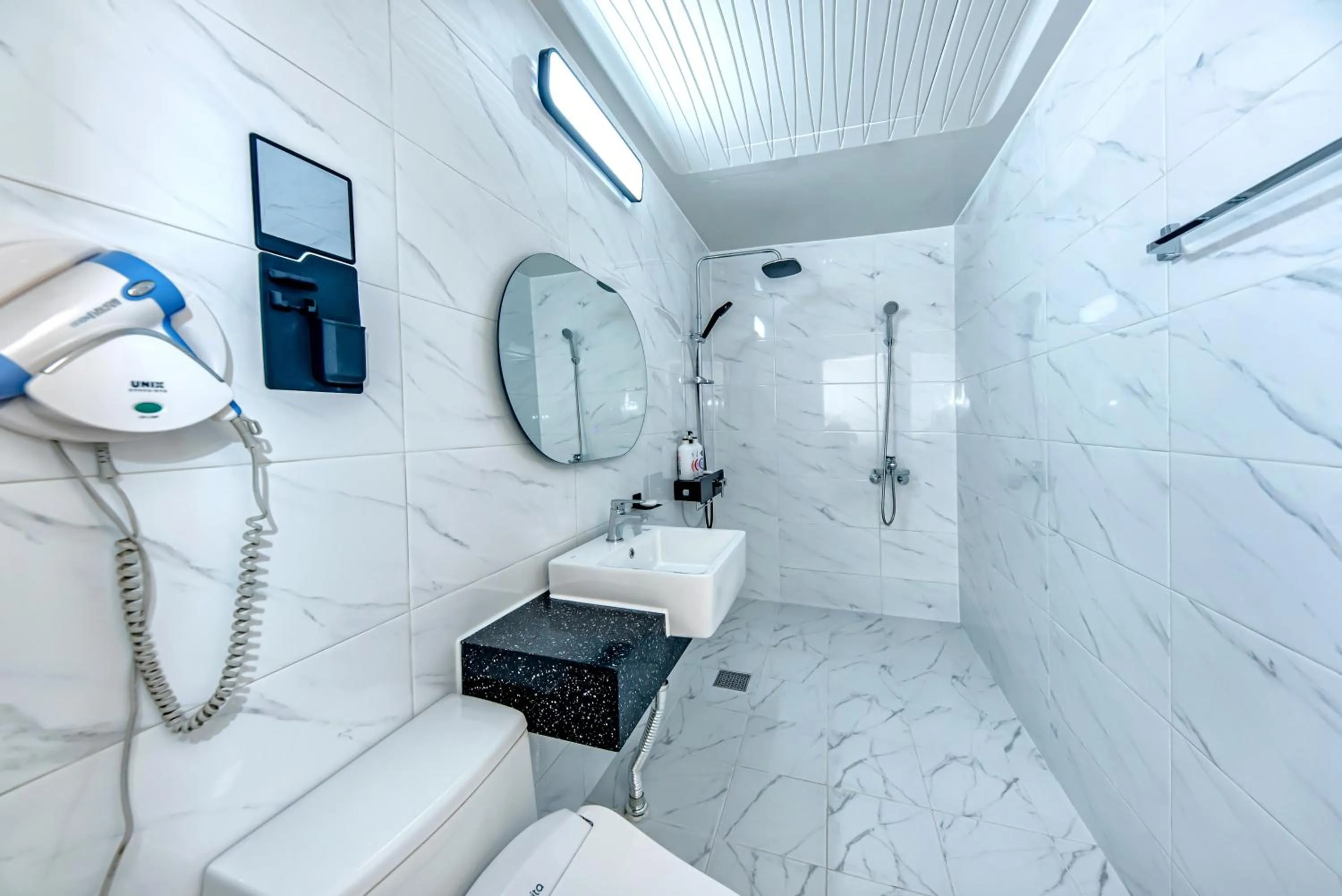 Bathroom in HS Tourist Hotel